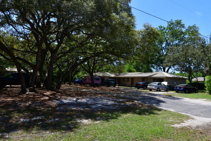 Great Investment Opportunity.  Super location  in Shalimar close to Elgin Air Force Base.  Great rental history.  Original owner.  Exterior is vinyl siding with metal roof.   Two units have 2 bedrooms 1.5 baths and two units have 2 bedrooms 1 bath.  Each unit has a one car garage.  Units also includes a inside laundry room.