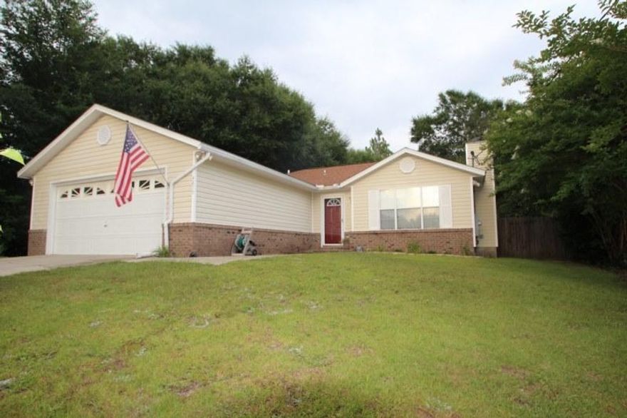 VA compromise short sale.This is SUCH a cute, well maintained home conveniently located south of I-10. Not many homes in this price range have a two car garage and a wood burning fireplace! The kitchen has had a major remodel and the entire home has a lovely dcor and is spotlessly clean! Large screened in back deck and tiled patio with a large, level, privacy fenced back yard with TWO storage buildings. Roof is in great shape. New HVAC in the last two years. It would be hard to find a better deal on such a nice home!!!