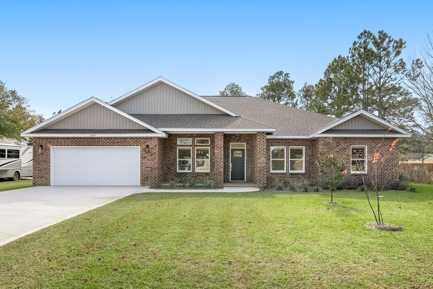 Beautiful BRAND NEW custom built home in perfect Navarre location! Great curb appeal with all brick exterior & covered front porch. Wide open floor plan with luxury vinyl plank floors, plantation shutters, high ceilings, & LED lighting throughout. Gorgeous kitchen with quartz countertops, mosaic tile backsplash, stainless steel appliances, center island with breakfast bar, & walk in pantry. 2 primary suites in this home, both with access to back porch! Main primary suite features sitting area, luxurious en-suite bath with double vanity & walk-in tile shower, & walk-in closet connecting to laundry with even more cabinet & countertop space. Large covered back porch & extended patio plus full sod & irrigation on entire 0.46 acre lot. This one is a must see!