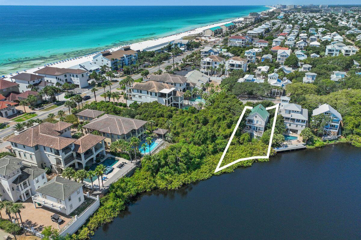 This 3-bedroom, 3-bath home is tucked away in the peaceful Kokomo Cove neighborhood, one of Destin's hidden gems, offering the perfect balance of privacy, comfort, and convenience just steps from the Gulf. Thoughtfully updated with modern finishes, coastal furnishings, a bright open layout, and wraparound balcony, the home was designed for both relaxing getaways and effortless entertaining. Upstairs, the lakefront primary suite feels like a retreat of its own, complete with a private balcony and tranquil water views. Best of all, the property is only a few minutes stroll to deeded beach access, giving you quick entry to the sugar white sands and emerald waters that make this area so desirable. At this price point, opportunities this close to the beach with both lakefront living and... private access are exceedingly rare, making this home a tremendous value in today's market.