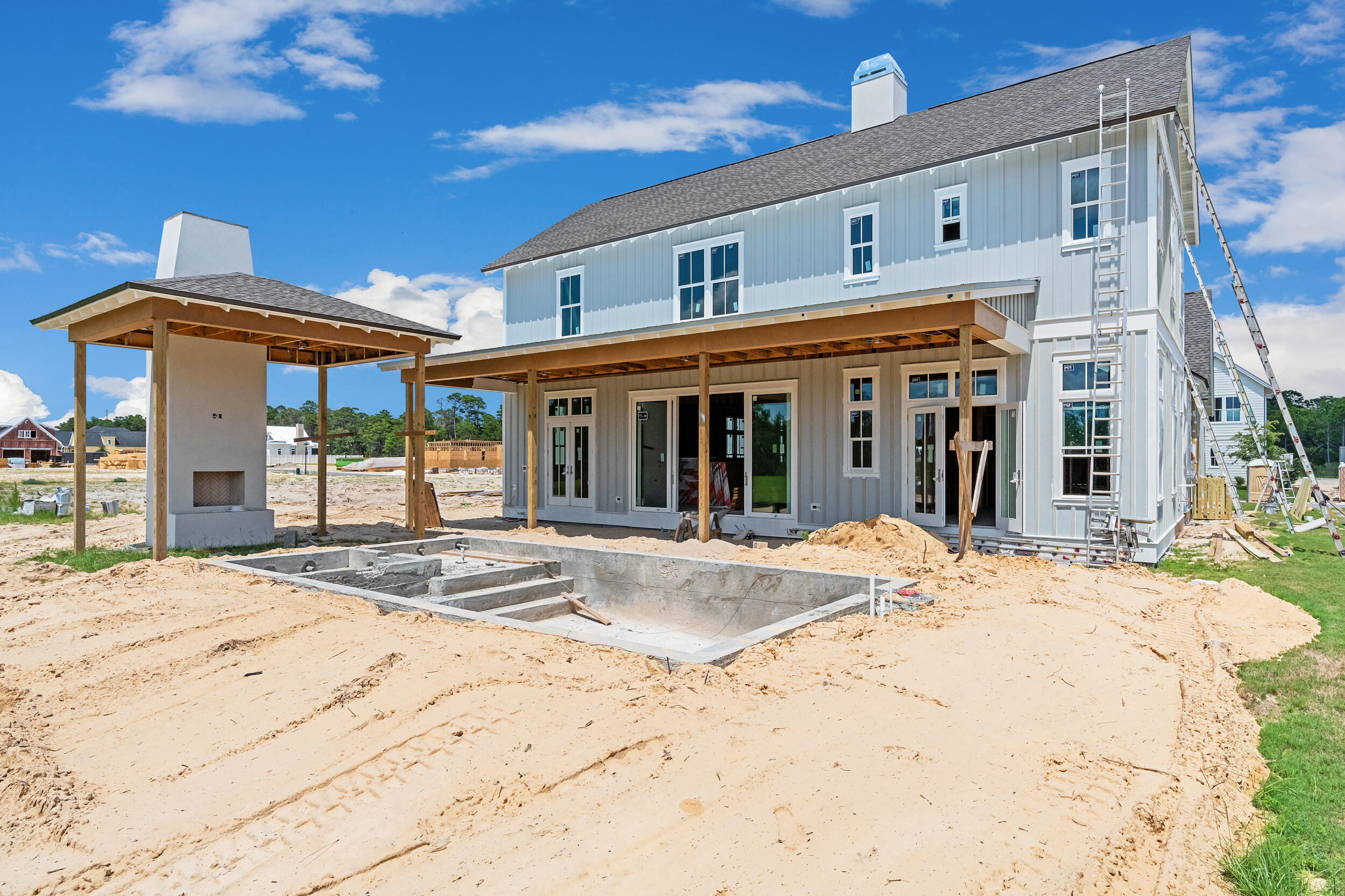 Indulge in the ultimate Florida lifestyle with the Darien plan from Romair Homes, where luxurious outdoor living takes center stage. Enjoy a resort-style backyard featuring a private pool and spa with a baja shelf, an expansive covered porch with a summer kitchen, and a cabana complete with an outdoor fireplace--designed for effortless relaxation and year-round entertaining. Currently under construction and expected to be completed in NOV '25, this thoughtfully designed home spans 4,660 square feet and is situated on a generous homesite backing up to natural common space. Inside, the Darien plan combines elegance and comfort with 12' ceilings on the first floor and 10' ceilings upstairs. The open-concept layout welcomes you with a grand foyer that flows into a spacious living room featuring a dramatic 42" fireplace with a stucco chimney. The chef's kitchen is outfitted with integrated Wolf and Sub-Zero appliances including a 48" gas range alongside stained white oak cabinetry, Silestone quartz countertops, and champagne bronze fixtures. A light-filled dining room and convenient wet bar sit just off the kitchen, ideal for entertaining.
The first-floor primary suite offers a peaceful retreat, while the second floor includes three additional bedrooms each with its own en-suite bathroom and a comfortable secondary living space. For added flexibility, a carriage house above the extended two-car garage provides a private 1-bedroom, 1-bathroom guest suite complete with a kitchenette and storage closets perfect for visitors, extended family, or a home office.
With premium finishes, expert craftsmanship, and timeless coastal design, the Darien plan offers a rare opportunity to own a new luxury home in the sought-after Watersound Origins community.
The Watersound Origins community is one of South Walton's most coveted neighborhoods for its exceptional amenities, beautiful new homes, and prime location. Amenities include the Village Commons pool & fitness center, sports courts including tennis and pickle ball, miles of nature trails, dock access to Lake Powell, unlimited golf, and lots of green space for outdoor play. The all new Watersound Town Center brings a new level of excitement and convenience to the community with a Publix Super Market, delicious restaurants, healthcare facilities, and more right at the entrance to the neighborhood!