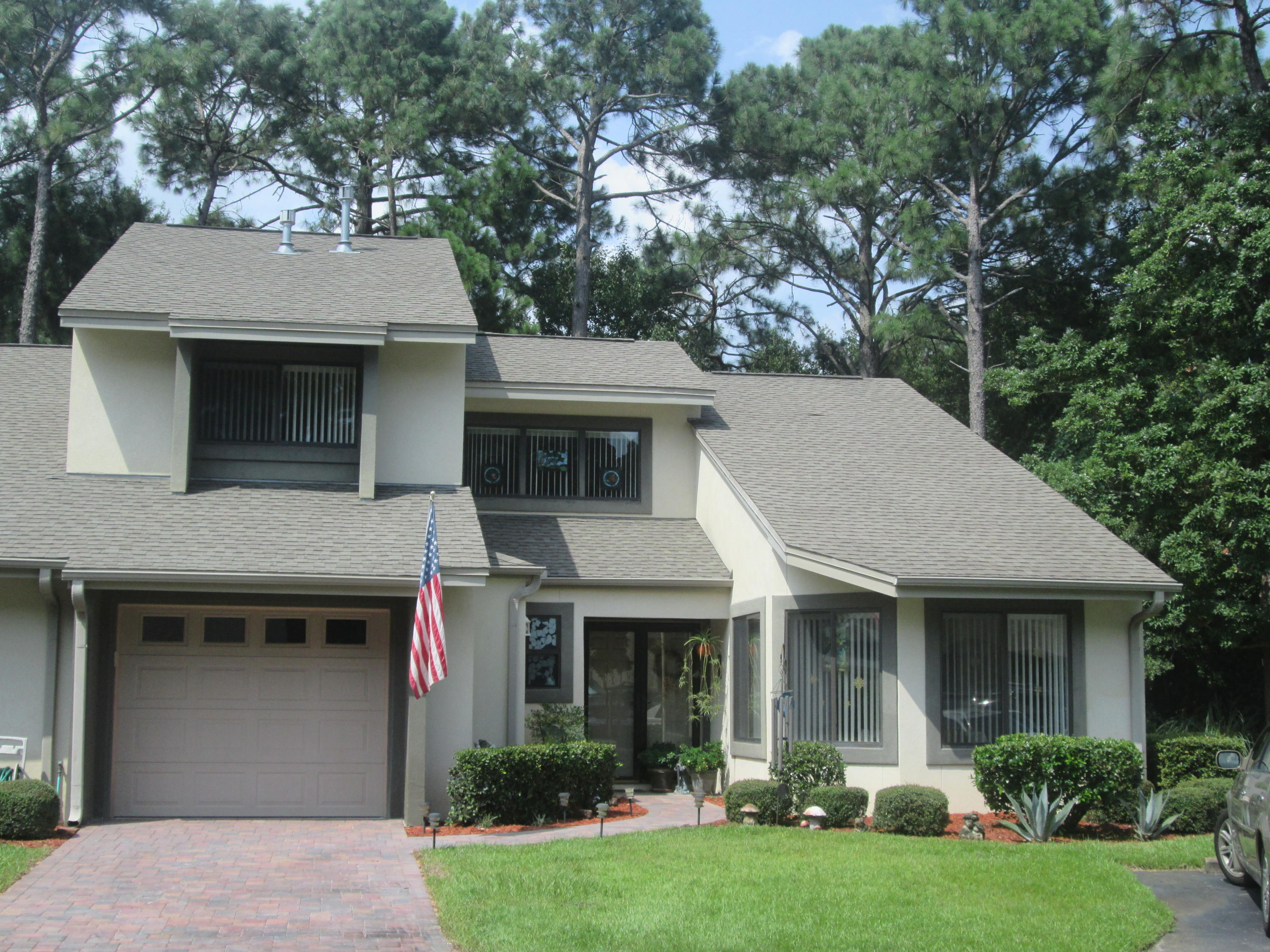 Absolutely lovely townhouse impeccably maintained with very tasteful enhancements. Built in 2005 with beautiful architectural details and located in the charming neighborhood of Gleneagles. This secluded location offers near immediate access to much of that which makes living in BWB so special. As you walk up to the tile front entrance notice the Storm door with glass / screen, motion detection light and welcome into the spacious foyer. Off the foyer the front closet has an extensive storage area and the half bath is elegant. The garage door entrance is just beyond the foyer which has storage space and cabinets, ceiling storage rack, workbench light, and refrigerator. Awesome kitchen with tile flooring, beautiful cherry cabinets with wonderful