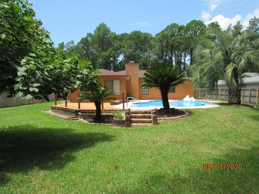 *Available JULY 10* Gorgeous pool home in the heart of Niceville! This lovely, 3 bed, 2 bath boasts an easy commute to beaches, bases, schools, shopping, restaurants, and more. Pool service is included for the large in-ground swimming pool, which is one of the highlights of the large, lush, privacy-fenced back yard, complete with deck and FL room with wraparound bar for relaxing or entertaining. It also has a spacious living area, formal dining, and a lovely kitchen featuring granite counter tops, plenty of cabinet space, and stainless appliances, including a flat cooktop stove. The master boasts a walk-in closet and its own en suite, both with barn doors. The two spacious guest rooms share a full guest bath, as well. There are laundry hookups in the 1-car garage. The washing machine and dryer are included with the rental. Pets may be considered on a case-by-case basis with prior owner approval and a non-refundable pet fee. No smoking, including vapes.