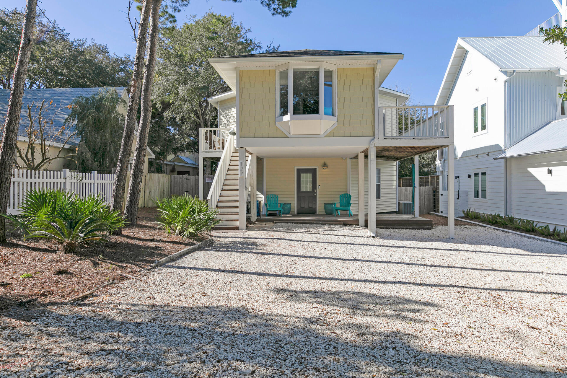 This Old Seagrove beach house is located just a block and a half East of Seaside! Besides the prime location, this property has so much to offer! Enjoy two separate living spaces, each equipped with a full kitchen and laundry. There is also a fenced back yard with private pool. The main living on second level offers three bedrooms and two baths with a bonus loft with two beds. Downstairs you will find the second living space which includes a full kitchen, queen size bed, bunk room area, full bathroom and laundry.Sold fully furnished. Currently this home would make for an excellent beach getaway or investment property.