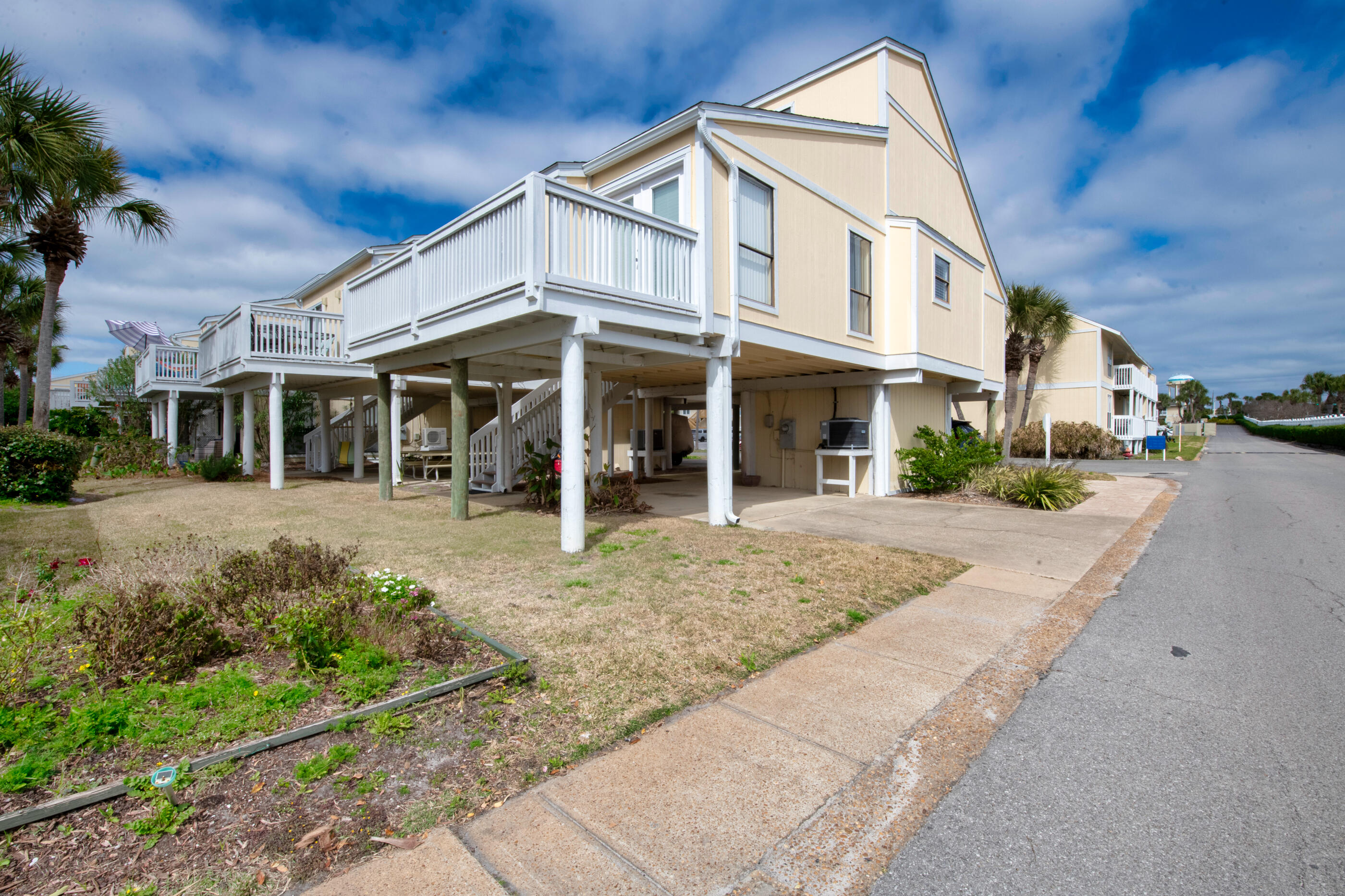 Be an owner in Sandpiper Cove and enjoy all the amenities it has to offer. This 3 bdrm, 2 ba  is sold ''AS IS''. This is a free standing unit with 3 covered parking spaces & room for an additional parking in the long driveway.  Laundry room is in the locked storage room on  the ground floor. Heading up the steps and enter into the dining area, living room with french doors that open to a balcony, 2 guest bdrms, guest bath, and kitchen.    Head up to the large master bedroom & full bathroom on the 3rd floor. New HVAC was installed in fall of 2020 and a new refrigerator in 2021.  Sellers have used the unit as a second home.  There is a special  assessment for 2022 which is approx $1180 a year. Buyer(s) are responsible to personally verify all details for property & dimensions.