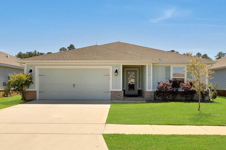 Seller is offering $5000 to assist with buyer's closing costs with acceptable offer. This impeccable home is better than new and includes numerous upgrades including vinyl plank flooring throughout, granite countertops in kitchen and baths, white cabinets with crown molding, beautiful pendant lights over breakfast bar, epoxy flooring in garage, gutters and tinted windows. This is one of the larger one story floor plans with a large master bedroom and bath and walk-in closet. You will be impressed with the condition of this home. It was recently pressure washed, deep cleaned and gutters cleaned out. The home has a hip roof and lightning rods which should lower your homeowners insurance. Refrigerator and custom blinds are also included. Step out of your living room on the large covered patio with ceiling fan. The community pool is very close for your enjoyment. There is a walking path designated for owners to four mile creek.  Riverwalk is convenient to the Publix shopping center and only about a 20 minute drive to the beach and numerous shopping and restaurants. This home is move in ready. Don't miss out on this one!