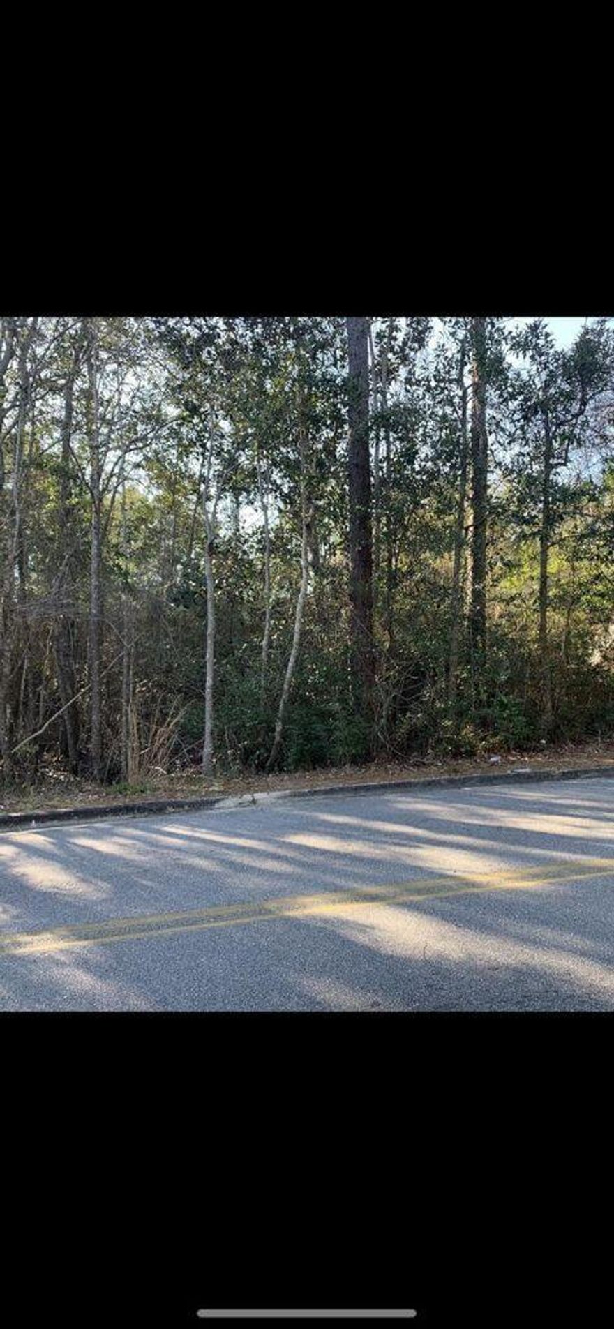 All measurements to be verified by interested parties.  Property is ''AS-IS'' and vacant.  Some undergrowth is heavy.