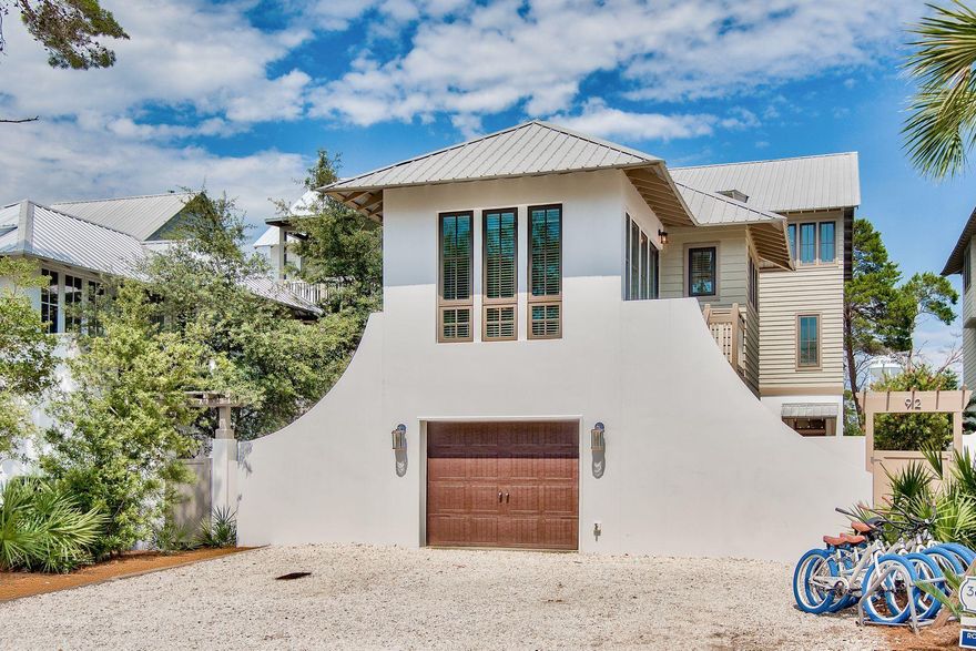 This 5 bedroom, 5.5 bath beach home is equipped with an elevator, separate coach house and just seconds from the community of Rosemary Beach. Fantastic rental property, vacation home or full-time residency located just off Scenic Highway 30A. You can wake up and walk to the Rosemary Beach town center for dining, shopping, farmer's markets, spas, or just having fun with your family and friends in your private pool. This beach home welcomes you with an expansive courtyard with salt water pool, private patio and sun deck separating the main house from its carriage home. Enter to the open concept spacious living and dining areas of this home with wood floors, fireplace, and natural lighting throughout the home with two balconies, including a private master bedroom getaway. Must see!