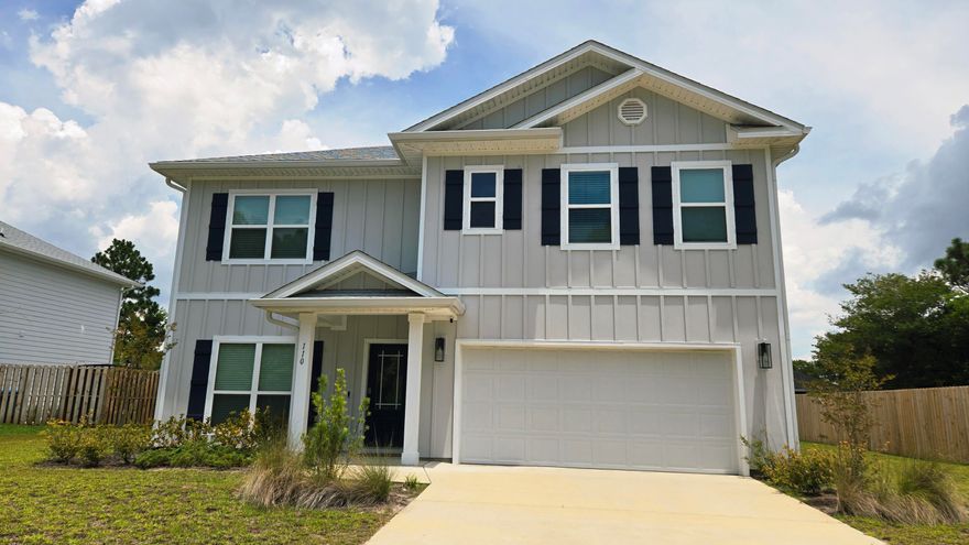 This beautifully designed 5-BEDROOM, 3-BATH HOME in Panama City Beach was built in 2023 and offers 2,556 SQ. FT. of MODERN COASTAL LIVING less than a mile from the Gulf. The thoughtful floor plan includes a CONVENIENT FIRST-FLOOR BEDROOM, ideal for guests or multi-generational living, and a VERSATILE BONUS LOFT UPSTAIRS that can serve as a home office, media room, or play space. Inside, you'll find LUXURY VINYL PLANK FLOORING, QUARTZ COUNTERTOPS, and IVORY SHAKER CABINETRY throughout, paired with 9-FOOT CEILINGS downstairs for a bright, open feel. Enjoy evenings on the COVERED BACK PORCH, while Hardie siding and a full irrigation system keep maintenance simple. A TWO-CAR GARAGE, spacious pantry, and MODERN TILE SHOWER add everyday comfort.