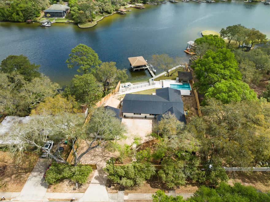 Waterfront home in the Kenwood Subdivision, sits on over 1/2 acre, with 150' of  waterfront footage.  Extensive exterior renovations have been made (see the full list in the documents section), the interior has been gutted and is framed and ready to go.. The seller does also have a set of Plans with engineering for 5 bedrooms/4.5 baths.  New impact windows, sliders and front door with 3 retracting 12' sliders in great room have been installed.  Fabulous bayou views