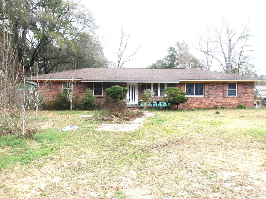 Price Improvement! Open your mind and your heart to this sweet home! Lots of room in this split floor plan home. An open living area and dining area just off the kitchen creates a large gathering space. Original wood cabinets in the kitchen, double door white fridge and dishwasher. Great stainless gas stove is a plus for any chef! Large pantry off of the kitchen leads to the utility room where the laundry hook ups are. Off the kitchen is the office and a large bedroom with full bathroom. Down the main hallway are three bedrooms and a full bath with a half bath off the back bedroom that has a door to the back yard. Large shed creates space for your projects or toys. Fruit trees and large yard ready for gardens and games! Call to see it today