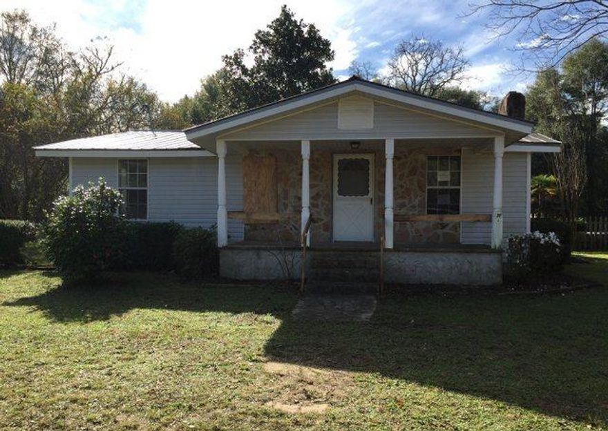 REO ~ Country Home w/ Pool offers lots of potential! The home is situated on .7 acres! The living room offers fireplace & tile floors. The back patio offers plenty of space for entertaining next to the pool. The property appraiser lists the property as a single family but per Okaloosa County the home is a mobile home that has been added onto. The work has not been permitted. The Okaloosa County has a permit was pulled for an above ground pool but not an in ground pool. There is also the possibility one of the additions was built over the septic. It is up to the buyer to perform due diligence.