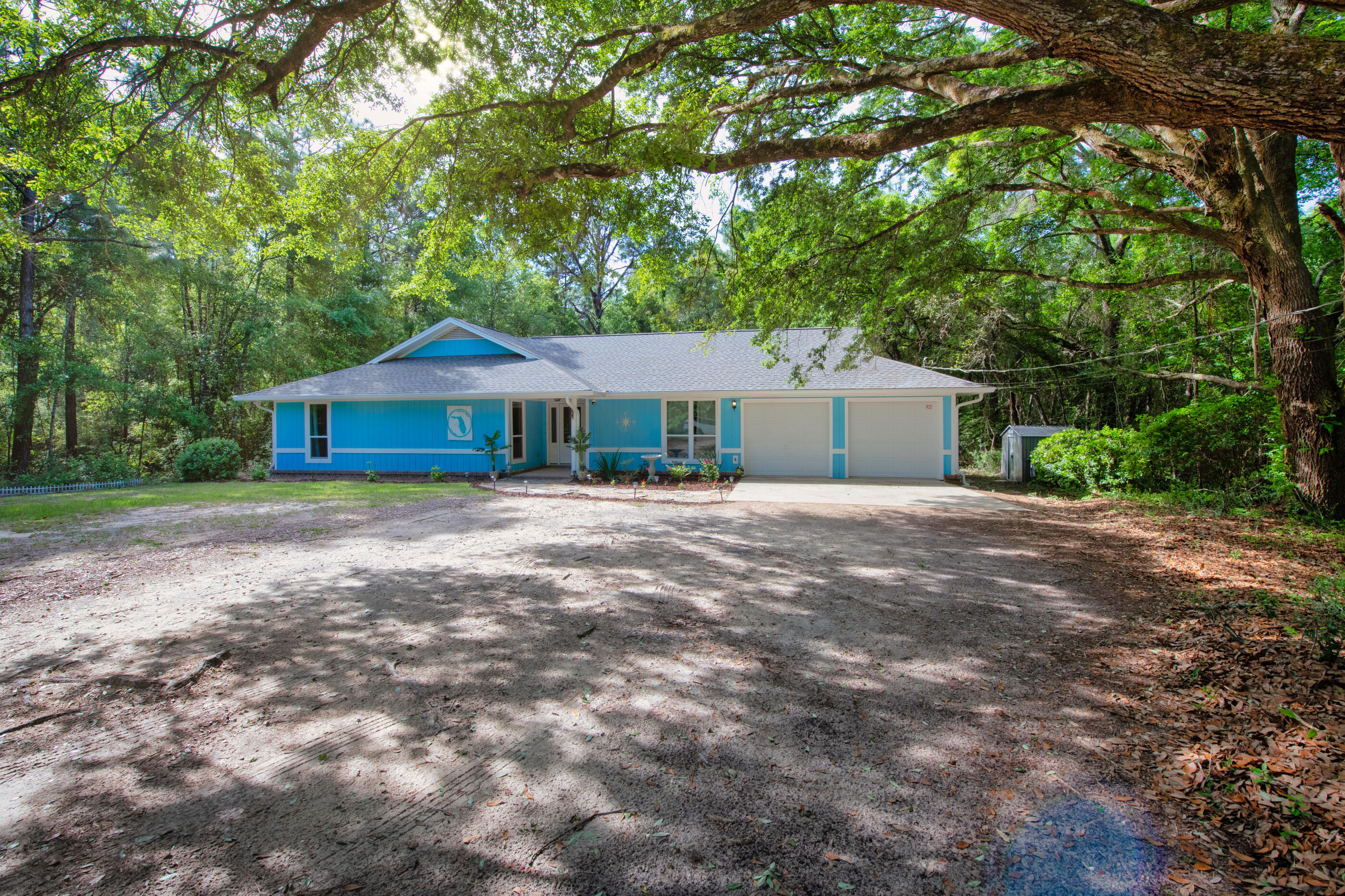 Welcome to 8529 Honeybee Lane...nestled on 5 acres with privacy galore! Plus, conveniently located near I-10. Over $90,000 was invested in renovating your lovely new nest. Looking to invest? Enjoy the extra income produced by this successfully established Airbnb! NO need to worry about a new roof, wiring or HVAC because ALL were updated in the last 2 years! This home boasts large living spaces that are perfect for fun gatherings! The BEAUTIFUL brick archway is part of the original architecture of the home and offers a distinctive focal point for your everyday living! The galley kitchen features brand new appliances along with handsome butcher block counter tops! You will also be delighted with brand new tile flooring in the living area in addition to new carpet in all 4 bedrooms!