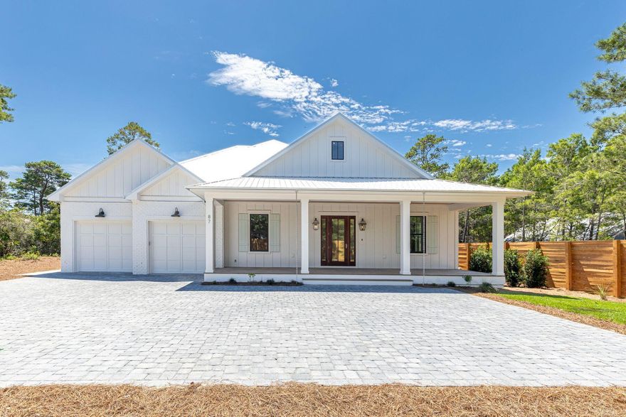 Introducing an exceptional single story new construction on a half-acre in Blue Mountain Beach, less than 2 miles from the beach. This 5-bedroom, 4.5-bath home offers more than 3,500 sq. ft. of refined living space, thoughtfully designed for both family and entertaining. Soaring 12' ceilings with exposed beams, pecky cypress accents, and warm coastal finishes create a timeless feel. The chef's kitchen features white oak cabinetry, premium appliances, and a spacious wet bar, and flows seamlessly into the dining and living areas. A gas fireplace anchors the living room, while large windows frame views of the private pool, spa, and oversized screened porch--ideal for year-round indoor-outdoor living. With 4,800 sq. ft. under roof, abundant storage, and a serene neighborhood with no HOAthis home blends luxury, convenience, and comfort. 

Walk through the grand 25 ft high foyer into a bright, expansive great room. The Primary Suite is a private retreat with a spa-like bathroom featuring a soaking tub, walk-in shower, and oversized closet. On the opposite wing, the Junior Primary Suite and ensuite bath overlook the pool and garden. Two more bedrooms share a well-designed bathroom with shower/tub, while a 5th bedroom enjoys its own ensuite bath. Enter from the oversized 2-car garage into a foyer-style mud room with full/laundry room flanking one side and an oversized walk-in pantry with a second beverage center on the other side. Thoughtfully planned storage and built-in shelving throughout make daily living both elegant and practical. 

Outdoor living is equally inviting. The pool and spa are surrounded by preserved native landscaping enhanced with mature tree selections. Beautiful shell rock pool decking is cooler on the feet, while a lawn area offers ample space for games. The expansive screened porch with outdoor kitchen provides the perfect backdrop for poolside gatherings, evening relaxation after the beach, or weekend cookouts with friends.

Located along scenic Highway 30A, this home offers unmatched access to both convenience and recreation. Trails in the State Forest, the 25-mile Timpoochee bike path, and the sugar-white beaches are just minutes away, along with world-class dining, shopping, and schools. Blending privacy, convenience, and modern coastal luxury, this single-level home is the perfect setting for life at the beach. 