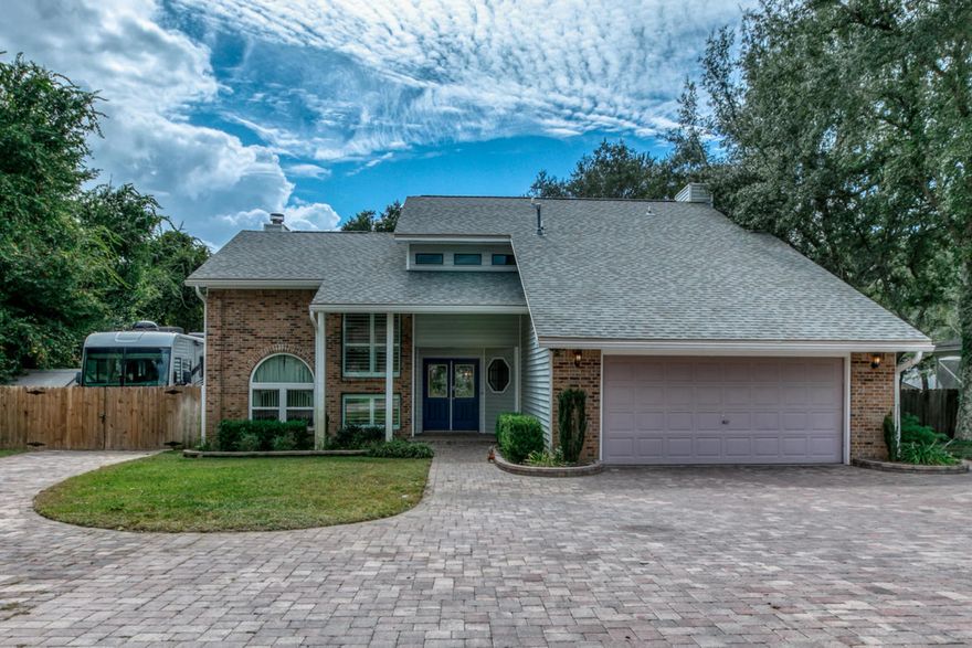 You won't believe this amazing two-story home nestled at the end of a tree-lined cove in the popular Bluewater Bay community. Inside and out, this home will not disappoint. Boasting 5 bedrooms and 3 full bathrooms, home is backed up with a Generac Brand Whole House Generator to keep you going when you need it most. Brick pavers adorn the entire driveway, Custom RV pad and Private Courtyard. The back yard is the perfect Oasis with a Pergola covered sitting area and walking stones surrounded by fruit trees and plants of every kind. This home has been well cared for, updated and maintained. Tennis courts & 4 swimming pools, golf and boat launch are available with membership. A-rated schools, quick commute to all bases, and short-drive to the beaches. Downstairs, new windows and remote controlled blinds have been installed in living room w/fireplace and dining room allowing natural light and beautiful views. The kitchen is open and inviting with a new stainless steel refrigerator, newer stove and a working island and is also home to the 2nd fireplace and sitting area. Recent renovations downstairs include adding a bedroom and full bath creating a second master suite option.  Upstairs, Master Ensute will truly impress featuring oversized bedroom, trey ceiling, a walk in closet, dbl vanity, garden tub, separate shower, and private toilet room. Outside, the RV pad is accessible by dbl gated fence and is equip with its own electrical RV outlet source for charging. The backyard Courtyard is a serene oasis including a  working fish pond, pergola, sitting areas and walking stones surrounded by fruit trees and plants of every kind. The back deck has fresh decking and finish. Back yard also houses a greenhouse, workshop, and tool shed all to convey as is.  The privacy fence includes a second dbl gated entrance from the back of the yard to Garden Oak Way. Florida Room is heated and cooled with ductless hvac unit. This is great, well cared home with all of the desired comfort features and more! 
All measurements and information deemed important to buyer to be verified by buyer. 
