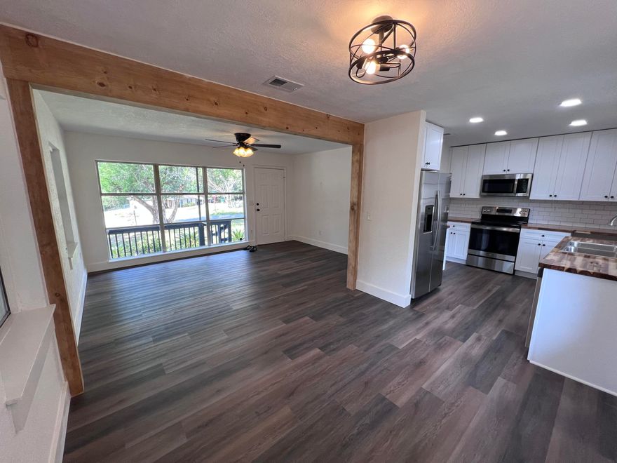 Cozy Florida cottage. Completely renovated inside with fresh paint, butcherblock countertops, soft close drawers and brand-new appliances. All new flooring has been installed throughout. Bathroom features an exhaust fan with a built-in bluetooth speaker. Home has a newer metal roof. Carport features large storage area and recessed light fixtures.