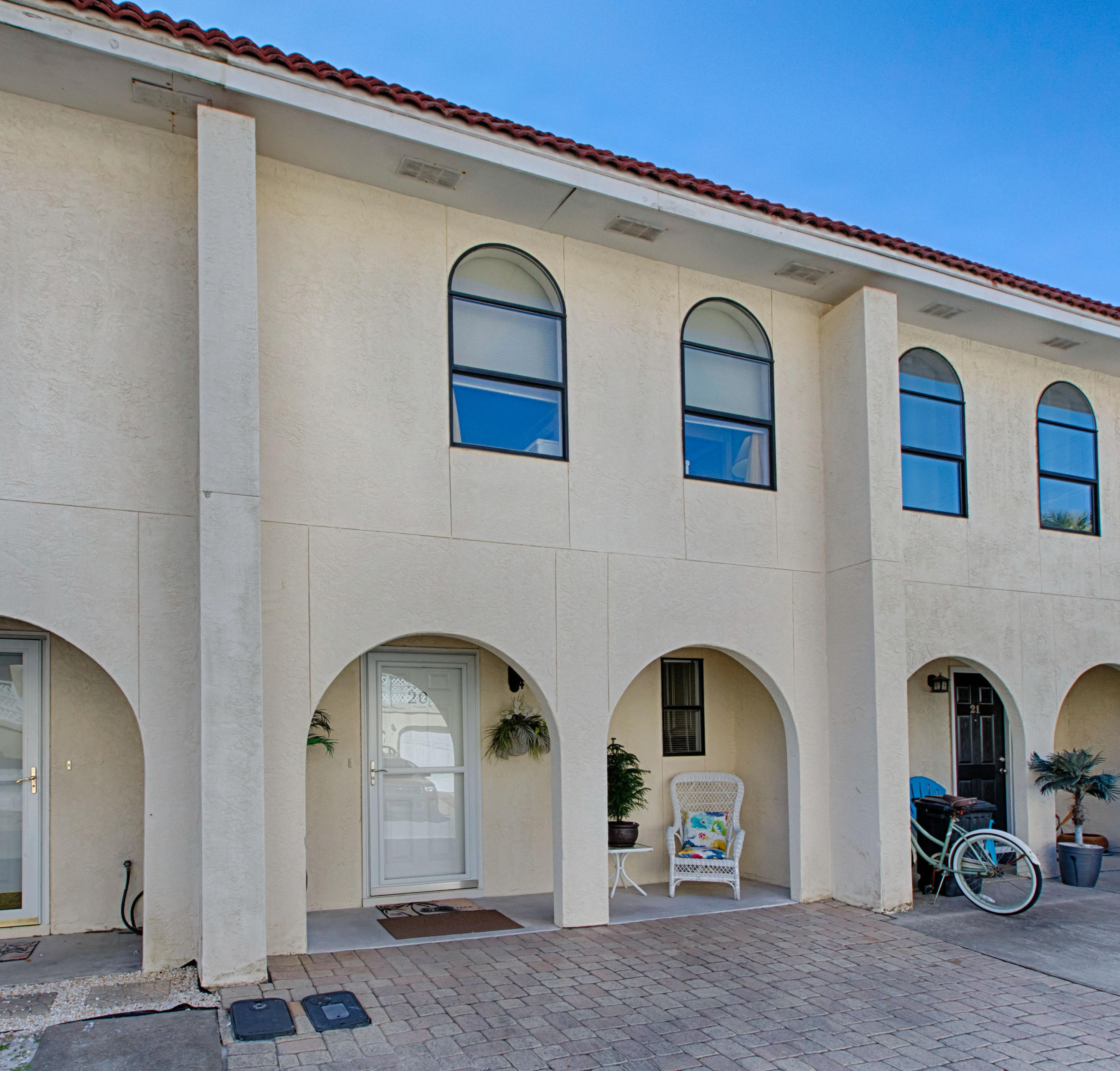 Perfect location, excellent rental income, no association fees, located approximately 250 steps from the beach. The entire upstairs has new hard wood flooring. Large bedrooms with attached bathrooms. The tiled downstairs features an open living/dining format with a breakfast bar. The kitchen has granite countertops, upgraded appliances and a large pantry. This unit is being sold fully furnished and is ready to be put on the vacation rental market!