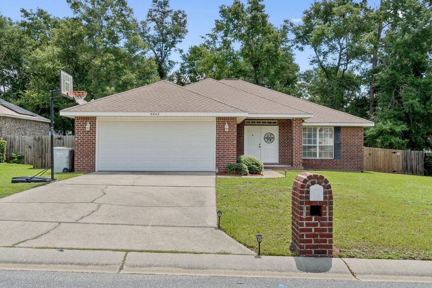 *Brand new water heater and roof will be replaced prior to closing!* Immaculate custom built home tucked away in the great neighborhood (no HOA!) of Woodbury Forest. Excellent location and convenience just off Garcon Point Rd in Milton less than 5 minutes to I-10 or Hwy 90! Easy commute to Whiting Field, Navarre, Pensacola, Crestview, & Ft. Walton Bch. You will love this spacious all brick home boasting over 1950sqft with 3 bedrooms, 2 baths plus a separate forming dining room at the front of the home currently used as a fantastic game room. Freshly painted walls, brand new carpet (that has STILL never been walked on with shoes), and tiled floors in 2020 make this the move in ready home you've been looking for. The layout upon entry through the double front doors opens up into a