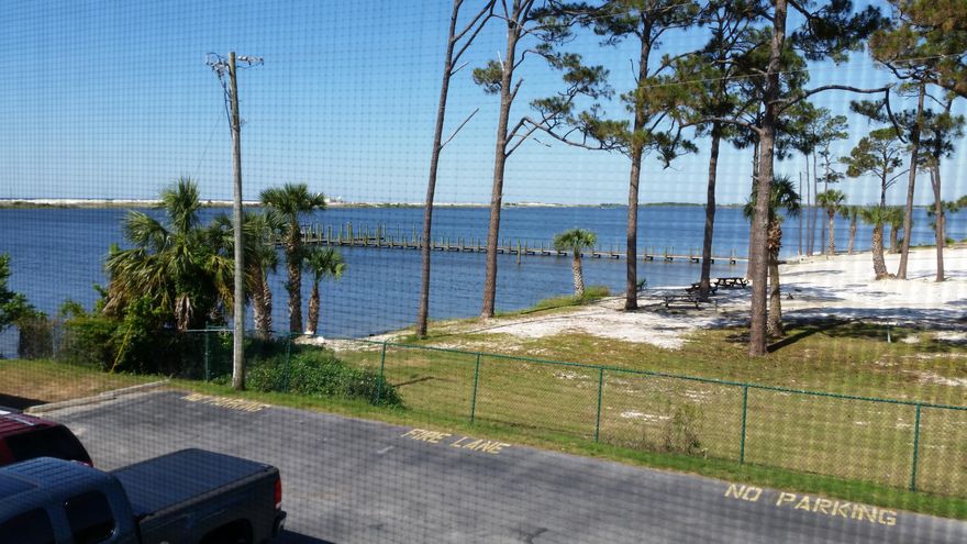 BACK ON MARKET OWNER WILLING TO PROVIDE SELLER FINANCING TO QUALIFIED BUYERS.This sparking clean unit boasts 2 bedrooms, 1 bathroom, spacious living/dining area, kitchen and over-sized deck. Enjoy a cool drink while you grill outside, entertain or watch a tennis match on the well-maintained grounds below. From the other side watch as endless boats travel the inter-coastal waterway. Billy Bowlegs boat parade could become your favorite event of the year!This is your chance to live next to water-front without the upkeep or high prices! Fountainhead offers numerous amenities for your enjoyment: community boat dock and slips, sound-front private beach and pool, clubhouse and laundry facilities. Tennis courts on site, parking for boats, trailers, and even special parking for moto Watch the pelicans dive, dolphins swim by and occasionally once a year you will find Pirates sailing by each year for the Bowleg Parade.  Fireworks several times a year can be seen from your own bedroom.