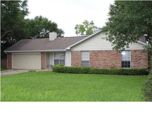 This clean well planned home has a nice large lot with some beautiful big trees. Private end of a cul-de-sac location. Huge double garage and fully fenced back yard with gates that would you allow to drive to the back yard for storage or just access. Close to brand new elementary and middle school. Skylight windows brighten your day. This 3 br & 2 ba home is close to medical and hospital. Location is great to shopping such a Walmart, Lowes and Publix. Relax in the back yard Florida screened porch. All appliances convey with home.