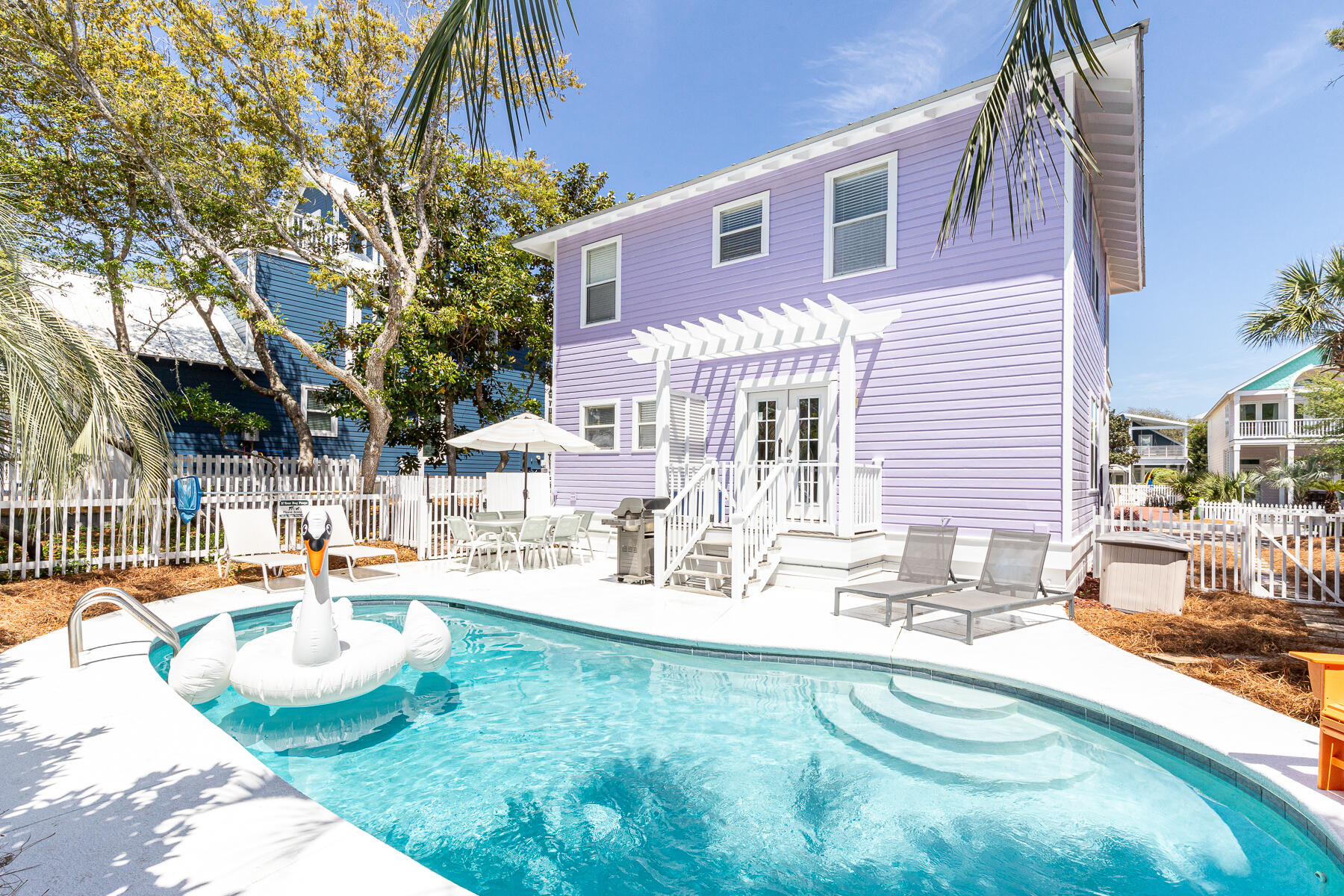 South of 30a, and just steps away from the white sandy beach, ''Rainbow Fish'' has charmed repeat guests year after year. Situated on the largest lot in gated Sunrise Beach, you'll love the privacy that the mature landscaping provides. The lot leaves room for a potential addition or garage and carriage house!  Enjoy the private heated pool out back and Gulf views from the second floor! There are hardwood floors in the main living areas and throughout the bedrooms upstairs. Directly at the end of the street, only 60 yds from the house, you'll find 1 of 2 neighborhood beach walkovers. The Gulf front community has over 500ft of neighborhood beach with seasonal beach service, and is conveniently located just a quick walk away from Shunk Gulley and all the dining and entertainment at Gulf Place