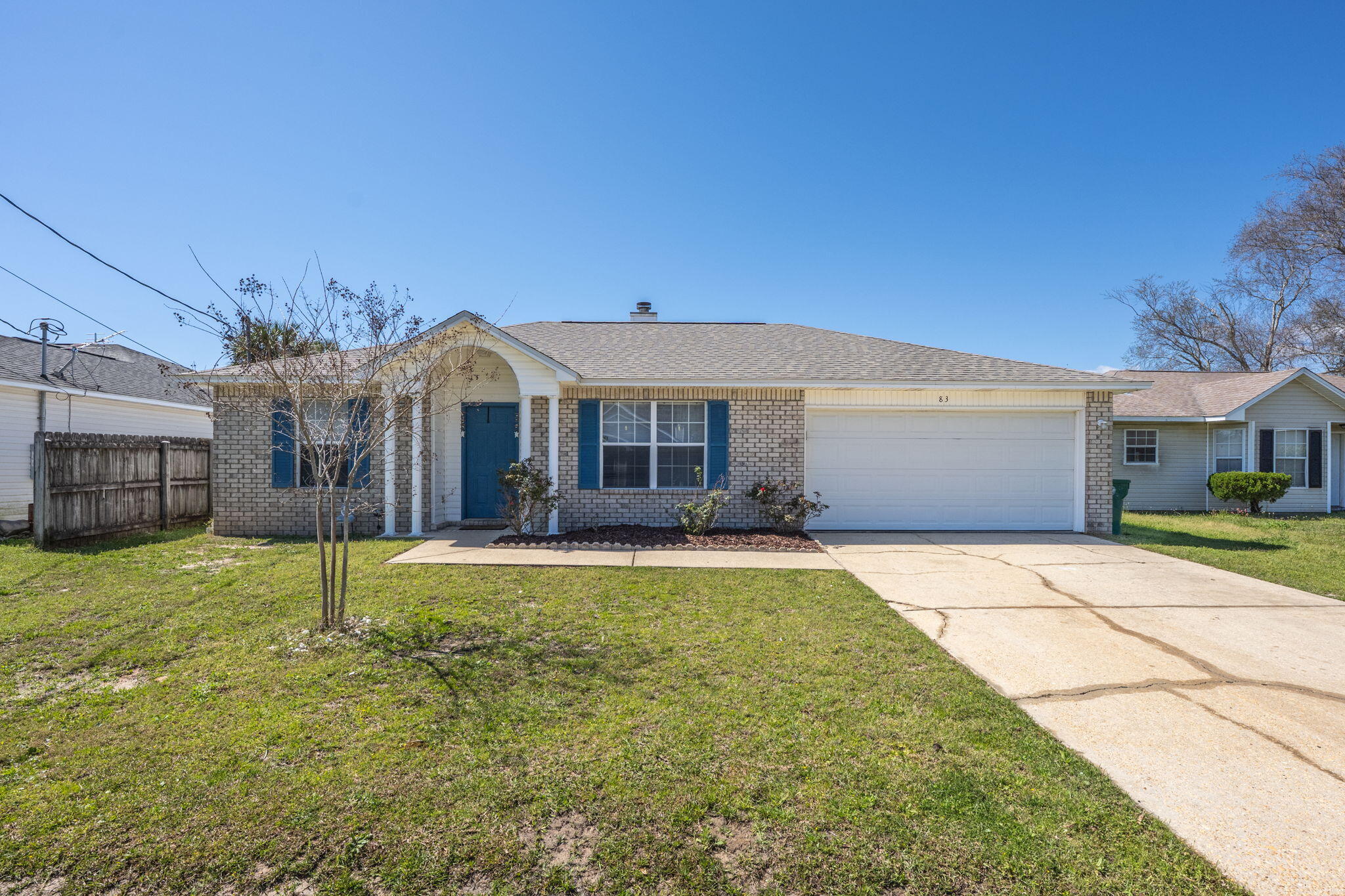 Welcome to 83 Stowe Rd in Mary Esther, Florida. This location is ideal for active duty and DOD personnel working at Hurlburt Field, as it is conveniently situated just west of the base. A short 13-minute drive will take you to Navarre Beach, where you can enjoy some of the world's best beaches at your leisure. For shopping and dining, Elevate Navarre offers options like Publix, Starbucks, and Buffalo Wild Wings. Heading east to Fort Walton Beach, you'll find additional choices such as Target, Santa Rosa Mall, and the upcoming Academy Sports. No matter which direction you choose, there's something nearby to enjoy. This home offers a practical living space with laminate wood flooring and an electric fireplace with a stone surround. The vaulted ceiling adds a sense of openness. The kitchen is equipped with stainless steel appliances and a convenient breakfast bar. The primary bedroom features a walk-in closet, double vanity, and a tub/shower combo. The split bedroom floorplan provides privacy, and additional features include a 2022 gas water heater, a 2021 roof and a privacy fenced backyard.