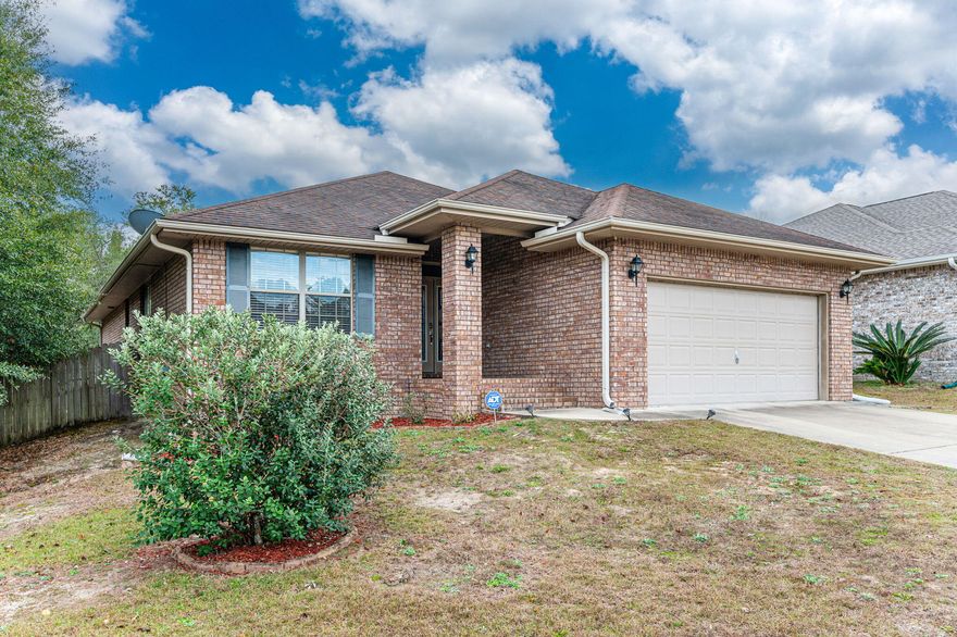 Seller offering $5k closing assistance and a possible 3.25% assumable VA mortgage. Charming four bedroom, two bath all-brick home with two car garage and open-concept layout, and great features. The kitchen is equipped with ample counter space, a step-up bar, pantry and modern stainless-steel appliances. Luxury vinyl plank flooring in the living room, dining area, and hallway. The master bath boasts double sinks and a large shower/soaking tub. The spacious master bedroom can comfortably fit a king-size bed and overlooks the private fenced backyard. Outside, a covered back porch and large deck provide the perfect setting for outdoor entertainment. Conveniently located near essentials such as a hospital, Walmart, and local businesses plus an easy commute to Duke Field and Egli