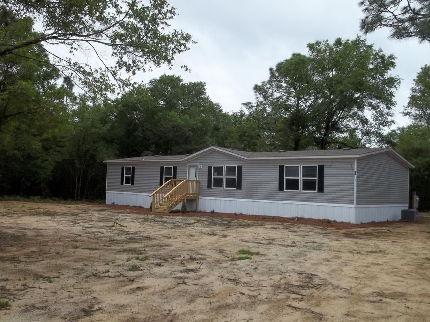 Brand new 4 bedroom 2 bath Manufactured Home on 1 acre. Located in a quiet neighborhood not far from town. Home has never been lived in.  Public boat ramp about 1-1 1/2 miles from the home on Juniper Lake Dr. You can catch a small view of the lake across the street through the neighbor's property. Listing Agent is related to Seller.