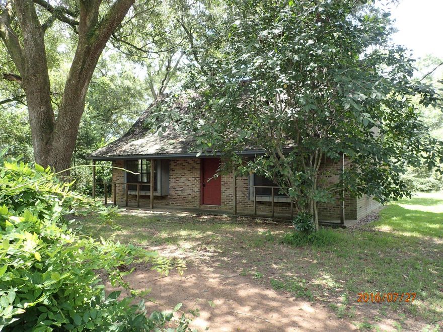 Located just minutes from Tate High School, this REO property is full of potential. This 3 bedroom 2 bath home is 1284sf and has brick and wood siding. Upstairs you will find 2 bedrooms and a full bath. Downstairs rests the master bedroom and a second full bath. Laundry is located just off the galley style kitchen. The living room is quite large for this size home and has french doors leading outside and some built in cabinets. Home will only qualify for FHA rehab loans. Call today!