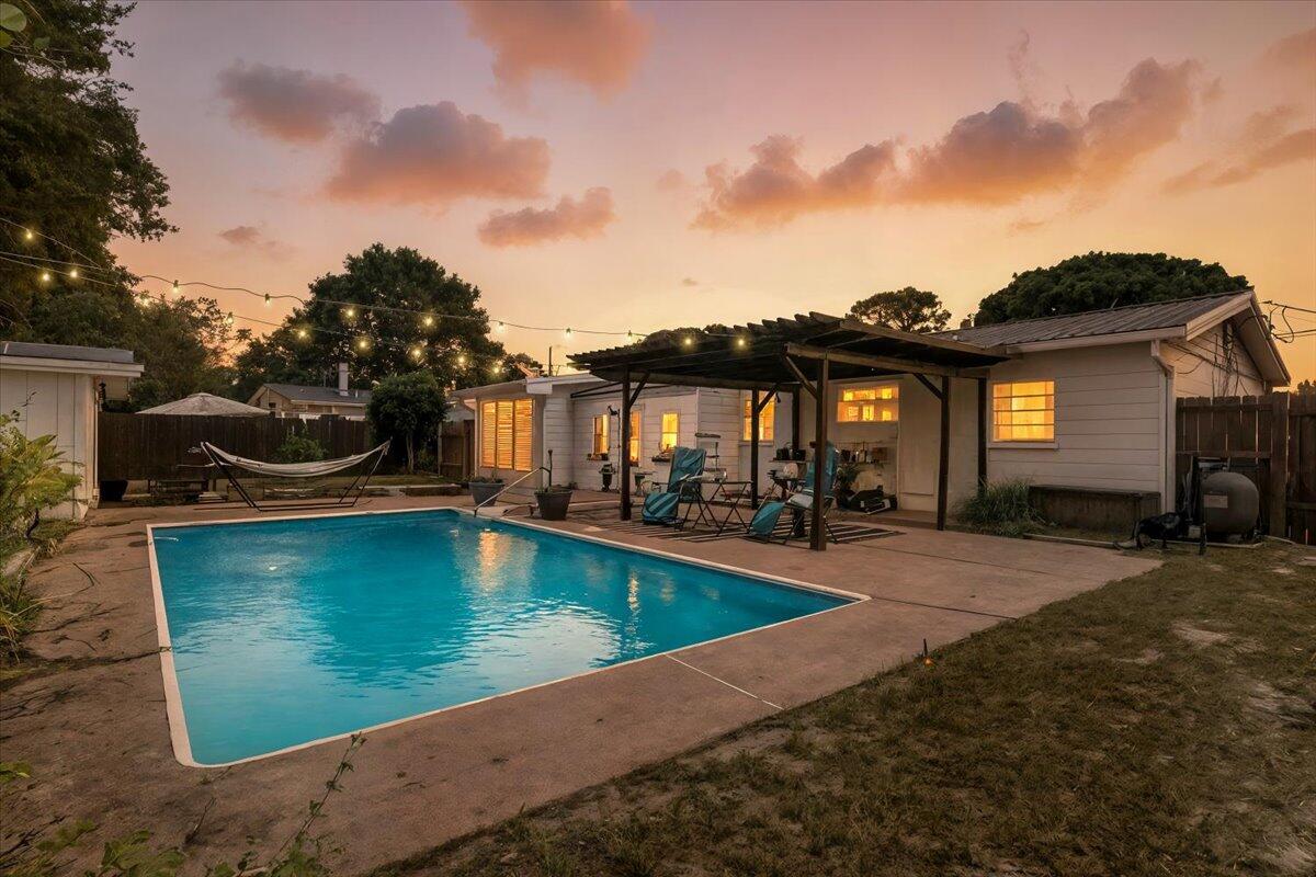 POOL HOME with a VA ASSUMABLE LOAN with a 4.375% interest rate for buyers w/ VA eligibility! This updated 4-bd, 2-ba home offers a coastal lifestyle with major upgrades already complete: NEW HVAC (2025), NEW Hot Water Heater (2025), NEW electrical rewire (2025), NEW LVP flooring (2025), smooth ceilings (no popcorn), & a durable metal roof. The split floor plan features a private primary suite with an ensuite bath & 2 walk-in closets. Enjoy a fully fenced backyard with a private pool, cabana, & detached building with power, ideal for storage, a workshop, or future ADU. Conveniently located near Hurlburt Field, Eglin AFB, beaches, schools, parks, dining, & shopping. Perfect for a primary residence or short term rental. Professionally deep cleaned and move-in ready! Schedule a tour today!