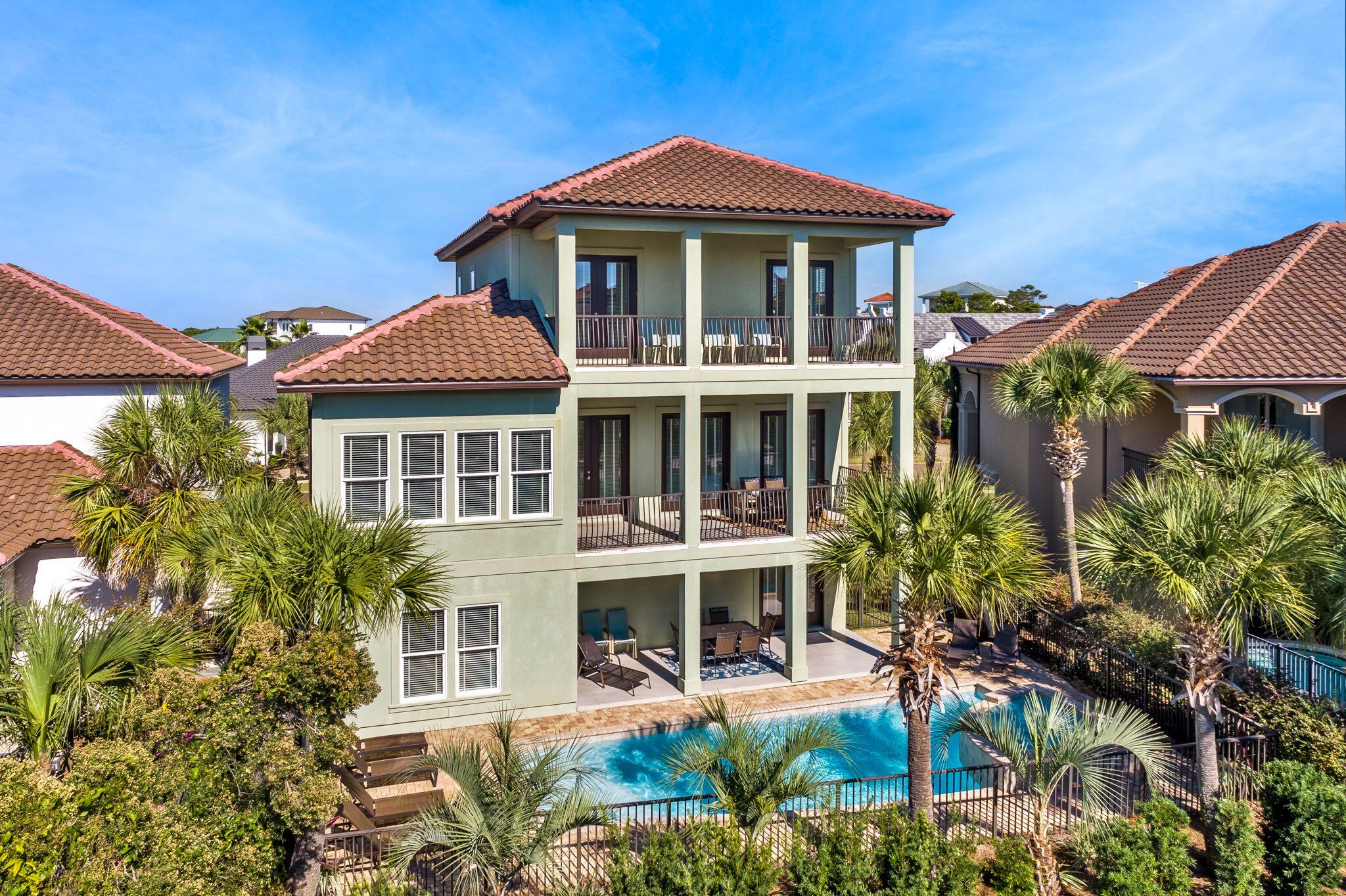 24 Tranquility is one of only five homes in the community with deeded beach access!! Ideally situated in the highly sought after gated community of Destiny East, this five-bed, five-and-a-half-bath retreat built in 2016 is a remarkable beach home that offers gulf views, a private pool with waterfall, and an elevator. Spread over more than 3,700 square feet of living space and, this three-story build features multiple living areas, multiple owner's suites on the first and third floors, and a spacious outdoor oasis for entertaining or relaxing.Built with a reverse home plan that places the main living and kitchen areas on the second floor, this floor also offers access to a generous balcony with sparkling gulf views. The home's first floor includes easy access to the pool with both covered
