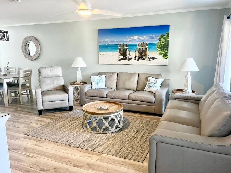 Freshly remodeled and turnkey, this Gulf Winds East townhome sits about 150 yards from deeded beach access with a beachfront gazebo. The open main level features driftwood-tone LVP flooring, shiplap accents, a quartz breakfast bar, and stainless appliances, plus a full bath that keeps sandy feet downstairs. Upstairs, two king suites each offer an updated en-suite bath, ample closets, and a private balcony. bunks and sleeper sofa boost capacity to sleep eight, served by a third full bath. Outdoor living includes two ground-level patios and two upper balconies, while the community adds a sparkling pool and walkable dining on Scenic Gulf Drive. Furnishings convey, and recent updates helped generate nearly $50K in annual short-term rental revenue--ready to capture peak-season