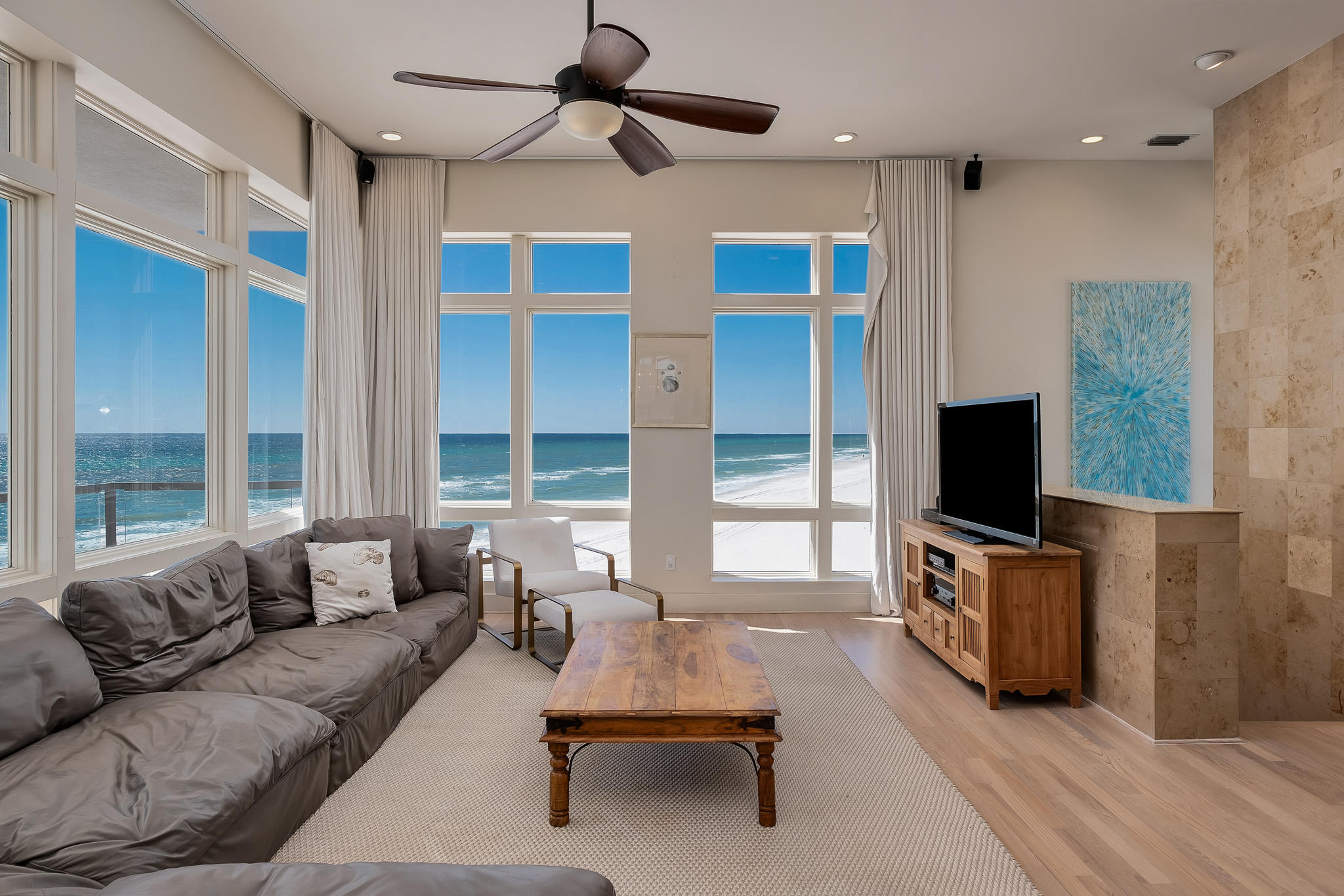 This sleek contemporary Gulf front residence was built to capture some of the most stunning views found on the Emerald Coast. With 91ft of beach frontage and walls of windows and glass balcony railing, the serene Gulf waters seem to flow right up to your door. The uniquely designed 2nd floor balcony holds the home's pool allowing for ultimate privacy while you enjoy the view. Renovated by renowned Birmingham architect Chris Reebals, the home offers modern design elements such as teak hardwoods, travertine tile, custom stone flooring, granite countertops and smooth stucco walls. 2 bunk rooms offer maximum occupancy in this incredible rental property. Boasting nearly $300K in yearly rental income, and no HOA fees, don't miss the opportunity to invest in this