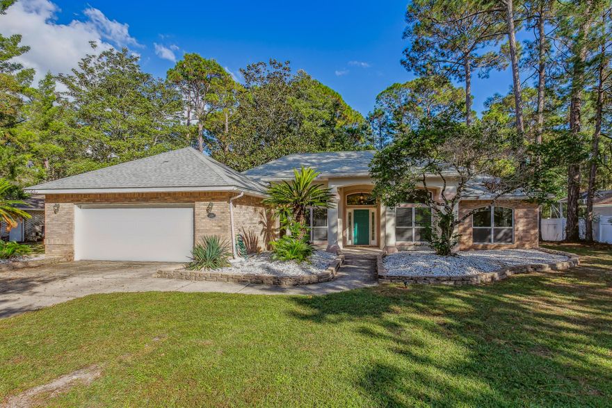 Location, location, location! Welcome to the highly sought after neighborhood of Dana Pointe. A short walk leads directly to the private neighborhood dock and boat launch on the Choctawhatchee Bay. Sitting on over half an acre, this home has endless opportunities inside and out. Featuring 4 spacious bedrooms, vaulted ceilings, and a beautiful fireplace, this home will not disappoint. The open floor plan and sunroom boasting a wet bar and beverage fridge make this home perfect for entertaining! Don't miss your opportunity to view this fantastic home!