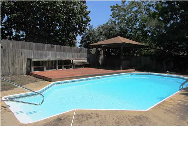 PRICE REDUCTION AND NEW POOL LINER!! NEW A/C!! Great location! In a cul-de-sac at the end of a quiet street, yet close to everything! This all brick 3 bedroom, 2 1/2 bath home features two living areas, separate dining room, and huge eat-in kitchen with granite countertops. The two-car garage has been converted to a spacious family room with a half bath. The room has built-in cabinets for storage, and would make a perfect exercise or game room with plenty of space for a pool table. You can enjoy the coming summer months relaxing in the screened-in porch, swimming in the in-ground pool or entertaining on the 400 sq. ft. deck which features a gazebo and a built-in bar. The roof was replaced in 2005, and all windows were replaced in 2007. The pool pump was also replaced in 2007.