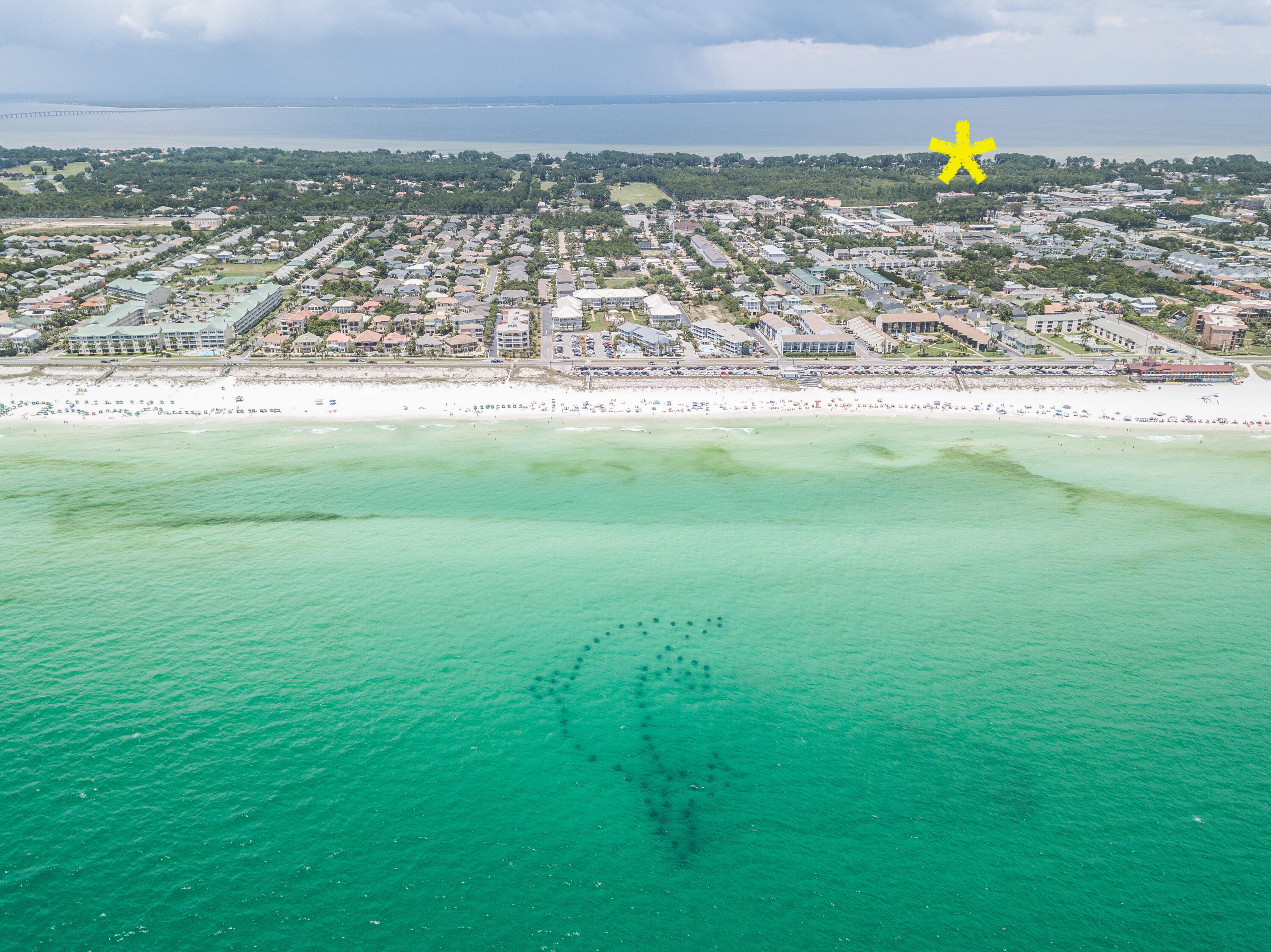 Dreaming of coastal living? Look no further than this exceptional quarter-acre lot, perfectly situated across the street from the shimmering waters of the Choctawhatchee Bay. Golf Cart distance to the Beach at Pompano Joe's, Legion Park with public boat ramp, Silver Sands Outlet Mall, and for the adventurous ones take the back roads all the way to the harbor in Destin legally. No HOA.