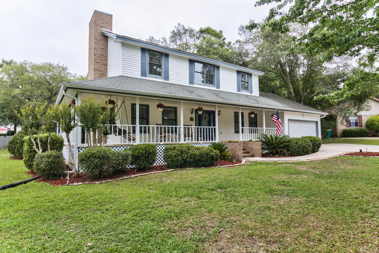 This recently renovated 4 bed, 2 Full, 2 half bath home is located on a large, landscaped, wooded lot on a cul-de-sac in the heart of Bluewater. The home's 112 foot long wrap around porch extends around 3 sides of the home, leading to the expansive screen room including the rear porch, a covered patio and 34x18 heated pool. As you enter the home you are greeted by an impressive cathedral ceiling, throughout the remaining first floor are 10 ft ceilings & dining room vaulted tray. Split Bedrooms & teen room with bath. Within walking distance of tennis, golf, pools, parks, trails, marina, resort style dining, with RV & trailer storage, ball fields & fishing. Under a mile to the grocery store and a short drive to Destin beaches, shopping & entertainment districts as well as Eglin & Duke Field.