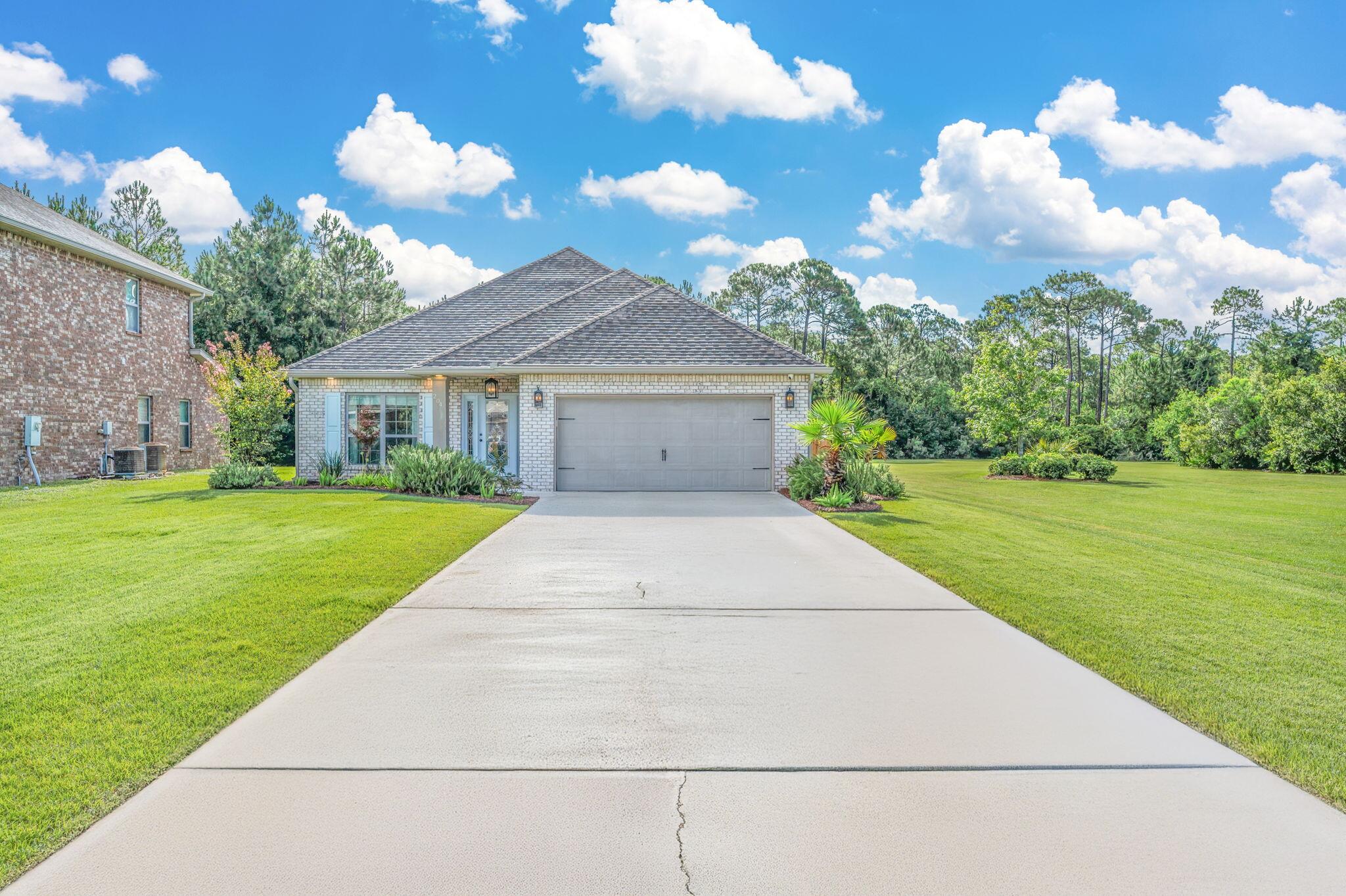 Nestled on a large corner lot with serene views and backing up to a natural forested buffer with easy access to pool and common areas. Nearly 2,000 SF home on .36 acre oversized lot featuring extended driveway and new privacy fence. Charming upgrades include paver patio, Solar Panels (PAID OFF), custom cabinets throughout with fine quartz, and designer lighting. An oversized Quartz island anchors the kitchen along with high-end appliances; a perfect place to gather while cooking or entertaining guests and family. An Office or Den (bonus room) with abundant natural light is located off the foyer. Backyard features covered patio lounge, and paver patio with lush landscaping and room for a pool. Zone X, Floor ins. is not required! Garage has attic storage access and Hurricane Panels.