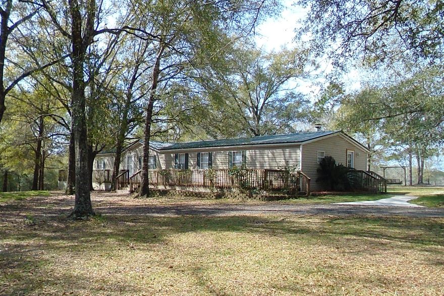 RARE FIND JUST OUTSIDE CITY LIMITS. Now is your opportunity to own a beautiful home on 10 acres with additional apartment/office spaces. Home has had a complete remodel that includes pine flooring, maple cabinets, stainless steal appliances, custom built-in cabinetry in living room, upgraded fixtures and cabinets in bathrooms, crown moulding, fireplace & so much more. In addition to the custom home, there is living space above the barn that would be perfect for a young adult or could be used as an office space. Also located on property is a 25x60 building with tack room that can easily store large RV. Building is equipped with large rollup door as well as two double doors. Property is cross fenced with creek/pond for your livestock to enjoy. MUST SEE-CALL TODAY