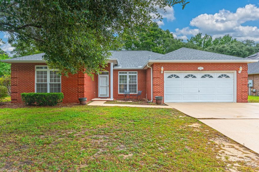 Welcome to this stunning 4 bedroom, 2 bathroom home located in the highly desirable gated community of Parkwood Estates. This open and bright house features stainless steel appliances, granite countertops, a tiled backsplash, gas stove, and a cozy gas fireplace. The primary bathroom boasts a double vanity and a walk-in shower for added convenience. Enjoy the Florida sunshine in the Florida room or relax in the privacy fenced backyard with a charming brick patio. New LVP flooring throughout, beautiful green space behind the house, close proximity to the 10/10 rated Bluewater elementary, mid-bay bridge and Destin beaches! Don't miss out on the opportunity to make this beautiful house your new home!