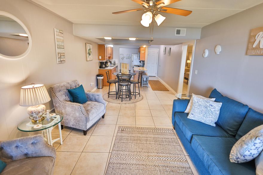 This Fully Furnished condo features two beautifully renovated bedrooms and one updated full bathroom. Three smart TVs, one in the living room and one in each bedroom.Elegant interior with granite counters, new appliances, and updated bathroom. Open concept fully stocked kitchen perfect for family gatherings.Just steps away from the waterfront, pool, and fishing dock. Private patio view overlooking the sound, providing a tranquil retreat.Free WIFI available throughout the condo.* Bedroom 1: King bed, TV, dresser, closet, and fan.* Bedroom 2: Double bed, TV, dresser, and closet, fan.* Kitchen Amenities: Fully equipped kitchen with dishes, pots, pans, silverware, and coffee maker.Spacious bathroom (bath towels provided).Smart lock access with a unique door code. Utilities Inc