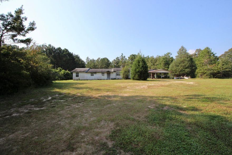 In one of the most desirable locations in north Walton county, this 7+ acre parcel is just east of town towards the ''valley'' but only 4 miles from town! On a paved road, there are 3 parcels being sold all together (seller will not separate). There is a home on the center parcel that needs work but is livable. Utilities in place and would make a great homesite for a new build!