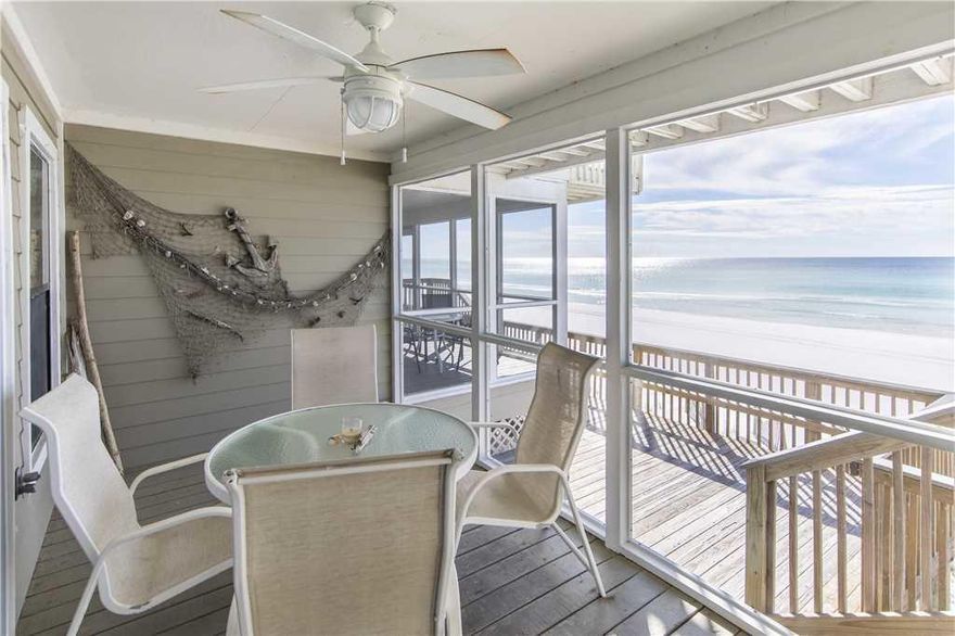 Rare opportunity to own a Gulf Front three bedroom two and a half bath! The first floor has a large open floor plan with a fireplace, tile in the kitchen, dining, living areas. The kitchen has serene views of Oyster Lake, a rare coastal dune lake. The living room opens to a large screened in porch over looking the beautiful Gulf of Mexico. There are three bedrooms and two baths on the second floor. The large gulf front master suite has vaulted ceiling, sitting area, master bath, walk in closet and two sets of sliding glass doors that lead you to the gulf front balcony. Dune 1 has only 14 units with more than 300 ft of beach and a GULF FRONT pool. Units rarely come up for sale here. Don't miss this opportunity.