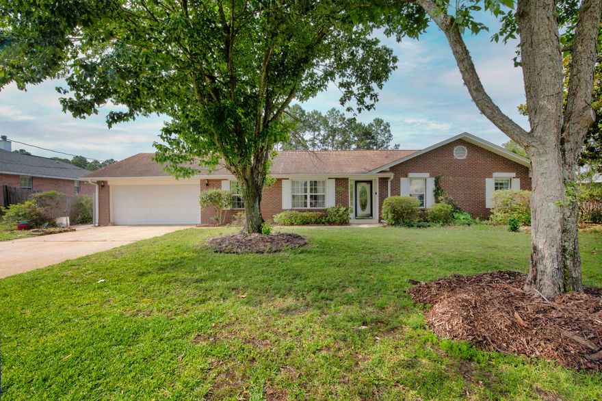 Experience serenity and security in this beautiful home. As you enter, the formal living and dining rooms are off to your left. The dining room provides direct access to the kitchen, which features granite countertops, double oven, flat cook-top, and views of the family room. The gas plumbed fireplace in the family room is perfect for curling up next to on a cold winter night.  All bedrooms are down the same hall with both guest and en-suite master bathrooms including whirlpool tubs to wash your cares away. Step out back onto your covered lanai and enjoy the sights of your fiberglass pool and huge backyard. Hurricane shutters are installed on all windows and doors to quickly secure your home and provide extra peace of mind. Centrally located, this home is waiting for its next loving owner.