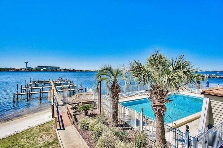 PRICED TO GET YOUR ATTENTION!! Centrally located, first-floor VA-APPROVED condominium in a lovely waterfront complex.. Convenient to Hurlburt & Eglin AFB providing effortless commutes. The Santa Rosa Sound is right out back! As an added bonus, an existing long term renter will provide instant revenue (lease through Oct. '25). Residents enjoy numerous amenities including a waterfront swimming pool, dock/boat slips, kayak racks, tennis courts, laundry room, and a clubhouse.
