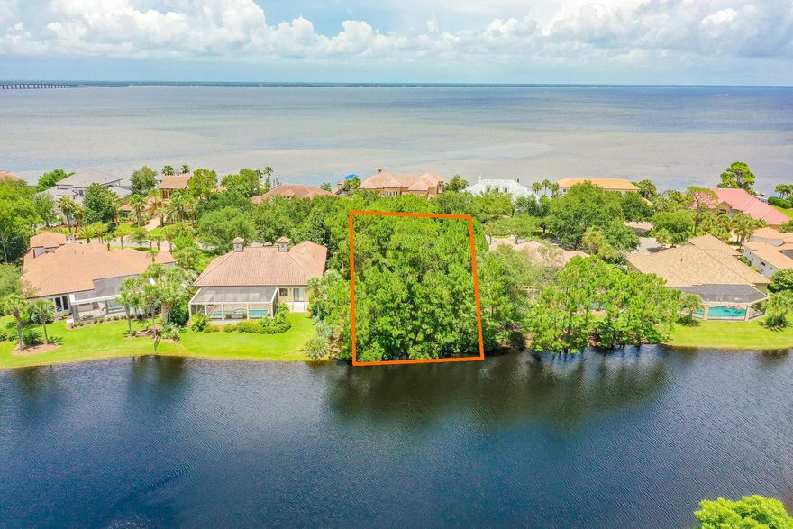 Beautiful lake front lot located across the street from the bay.  The lot backs up to a large lake and can have bay views from upstairs.  Build your dream home in this exclusive gated neighborhood and enjoy all it has to offer.  Regatta Bay has it all - tennis courts, pickleball courts, swimming pools, and golf.