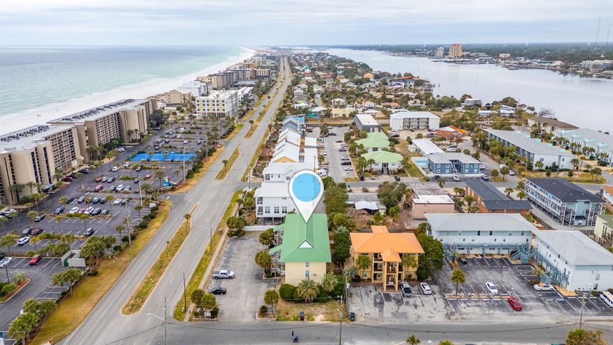Escape to paradise! Great investment vacation property radiates tropical charm. Located just 100 feet from our white pristine gulf beach, this property promises sun, sand, and fun! Waterviews from its ideal second story placement, and updates throughout-this is the ONE. Beachy interior with open kitchen floorplan, white and blues for that ocean vibe, stainless appliances, and hard floors. Modern fixtures and ceiling fans. Sold fully furnished, and turnkey ready to make the ideal investment.  This property has a bonus balcony, exterior storage closet and comes equip with an in-unit Washer and Dryer.