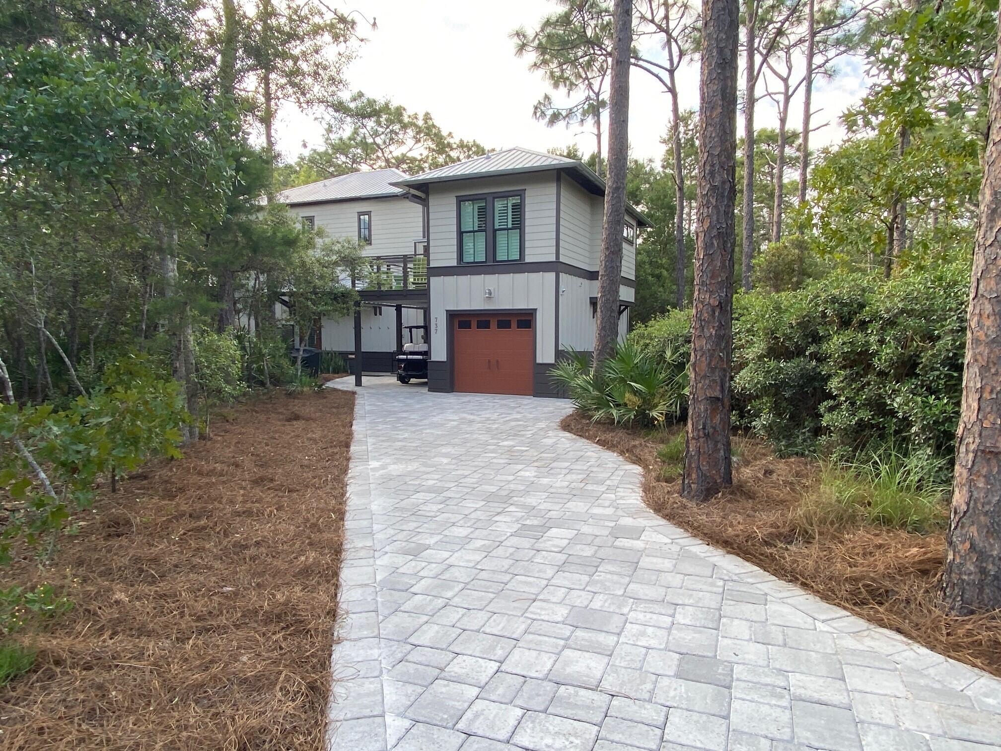 This unique property is the perfect combination of cozy tranquility and modern luxury beach cottage with Carriage house. Situated on the edge of Deer Lake State Park, blocks from the sand, between Alys Beach and the Hub. The residence was meticulously customized and crafted with three spacious bedrooms, each with en suite baths plus a fourth suite in the Carriage and kitchenette over garage. Many quality finishes and other upgrades throughout including a peaceful covered/screened porch, a sleek outdoor shower and extensive trim and shiplap. This Florida-style cottage sits on a lush, wooded estate alongside the quiet park and just minutes from the beach access. Unbeatable location and one of the best lots in the community, this rare property truly has it all!