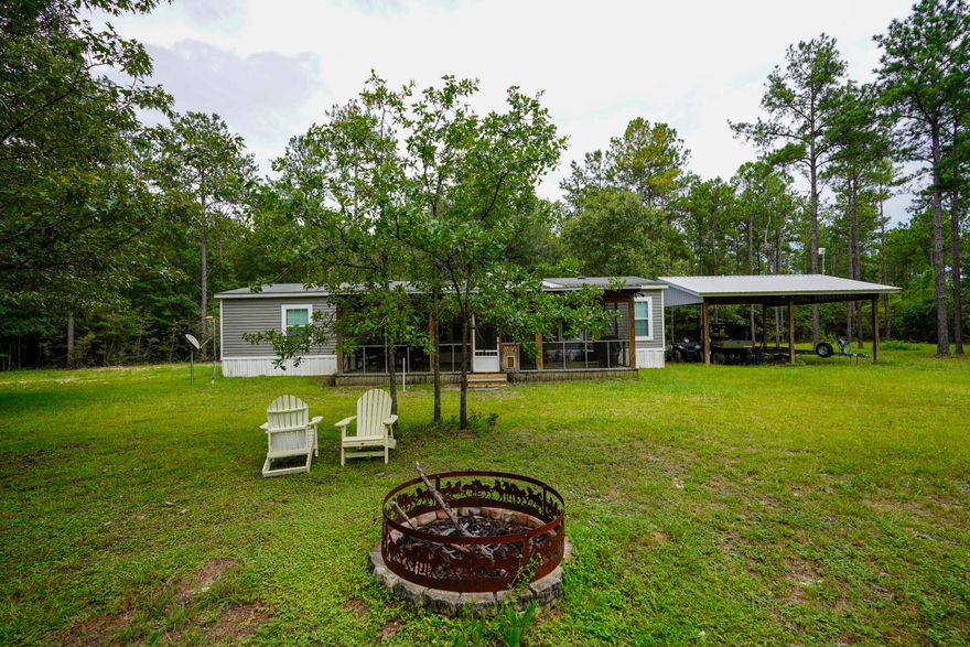 Turn-key 29-acre retreat on two lots in Walton Plantation--high and dry with no wetlands. The home site sits on Lot B6 with a well-maintained 3BR/2BA manufactured home featuring a screened porch and comfortable living. Lot B7 is included in the sale and offers the option for an additional homesite or resale. The land is dotted with Oak, Magnolia, and Dogwood trees, with cleared property lines and multiple hunting areas. Improvements include two pole barns, power, septic, and a private well. With gated entrances at both ends, access is easy and secure. Perfect for a homestead, hunting camp, or long-term investment.