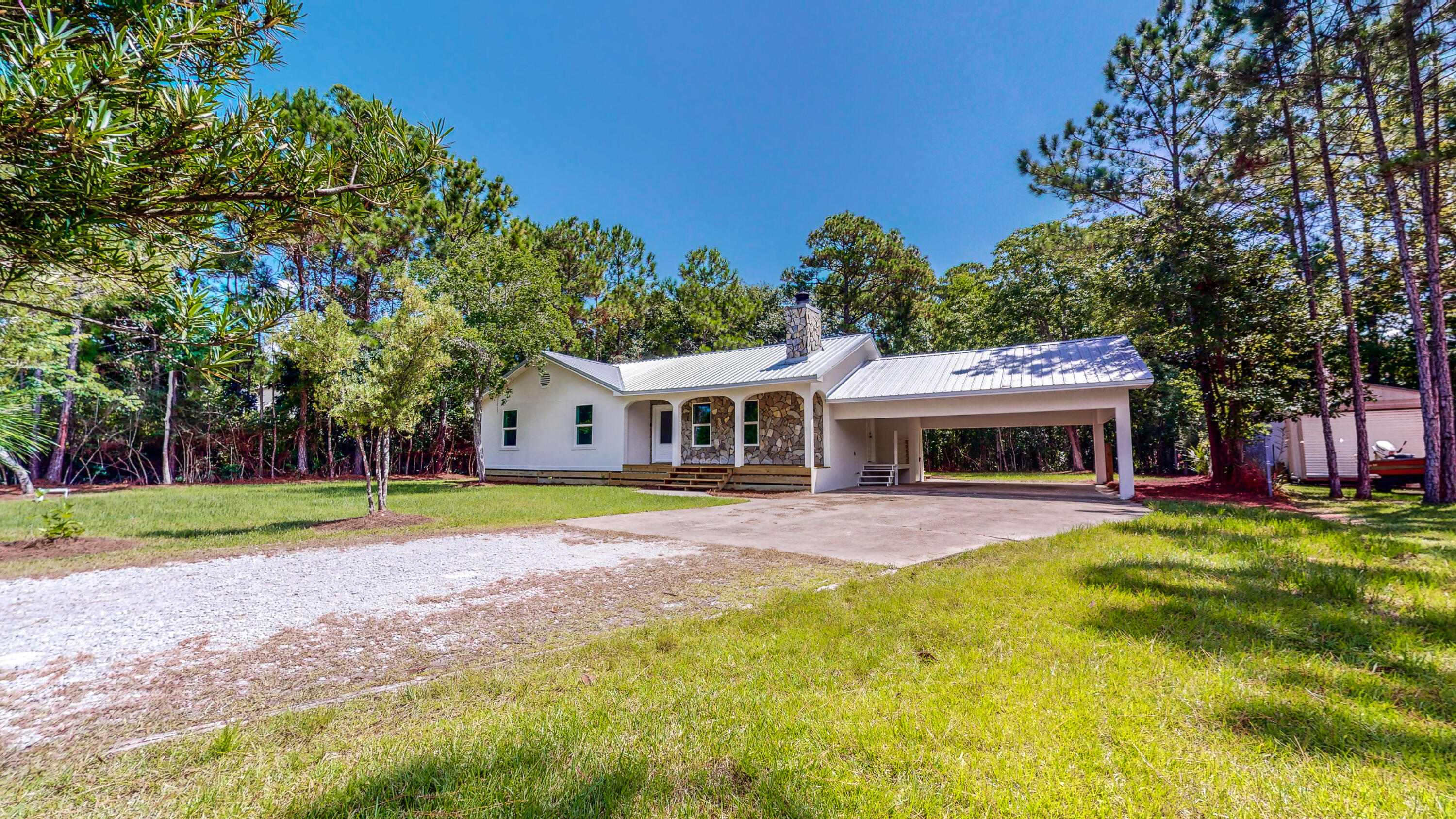 Fully renovated 3 bedroom / 2 bathroom home on double lot totaling .29 acres with no HOA. Come see this beautiful freshly renovated home with new metal roof with ProDex insulation, new insulation in crawl space, stucco, front porch, stainless steel appliances, AC, water heater, paint, granite countertop, fixtures, LVP flooring, exterior doors, and high-efficiency windows. This home is move-in ready.Conveniently located near Cesna Landing and Hogtown Bayou for all your water activities. No HOA, so park your boat and other watercraft onsite.
